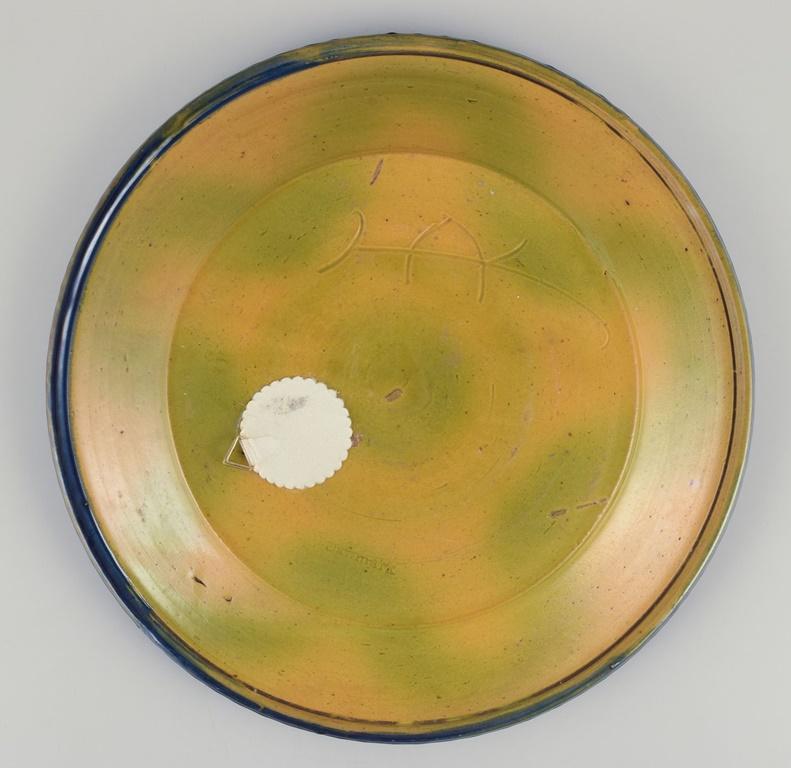 Mid-20th Century Kähler, Denmark. Large ceramic dish decorated with foliage. Ca. 1930s For Sale