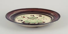 Kähler, Denmark. Large ceramic dish with motif of a dancing woman.