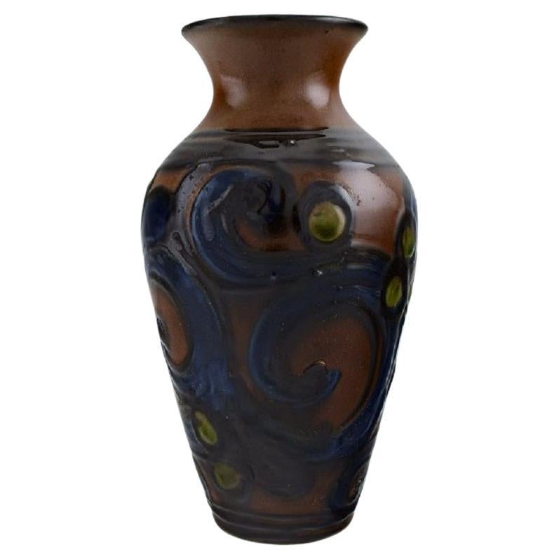 Kähler, Denmark, Vase in Glazed Stoneware, Blue Foliage on a Brown Background For Sale