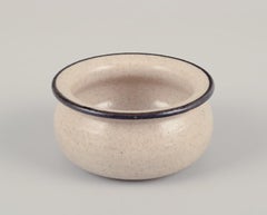 Kähler. Four small ceramic bowls. Glaze in sandy tones with a black edge.