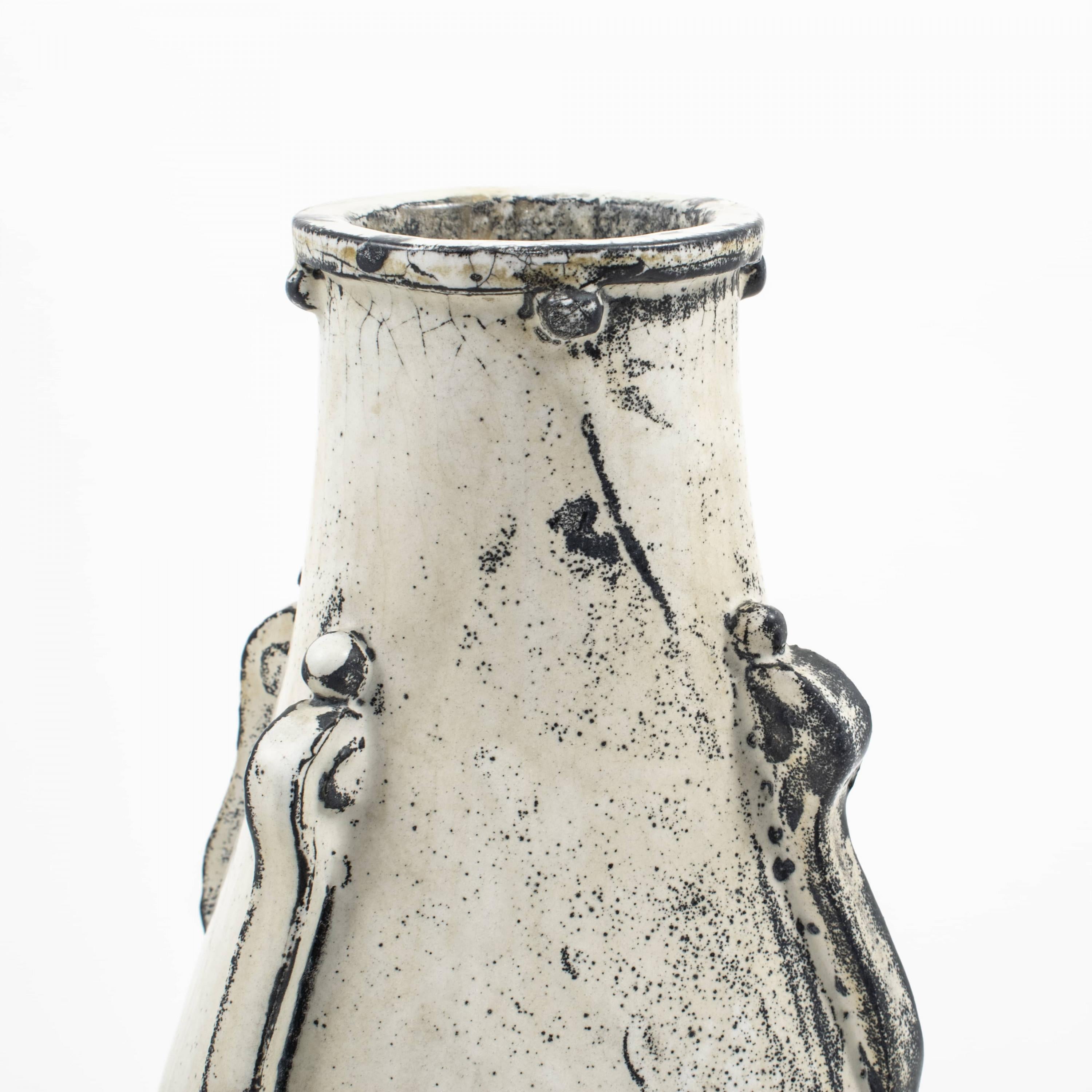 Designed by Svend Hammershøi 1873 - 1948.
Kähler, Denmark, glazed vase, 1926 - 1930s.
Glaze in black and white c. 1926 - 1928.

Jens Thirslund is the artistic leader who came up with the black and white glaze in 1926.