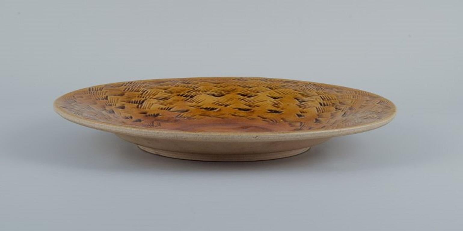 Kähler, HAK, large glazed stoneware bowl.
Designed by Nils Kähler. Uranium yellow glaze.
1960s.
In excellent condition.
Signed.
Dimensions: D 31.5 x 4.0 cm.
