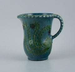 Kähler Jug in Glazed Ceramic, Decorated with Flowers on a Blue Background