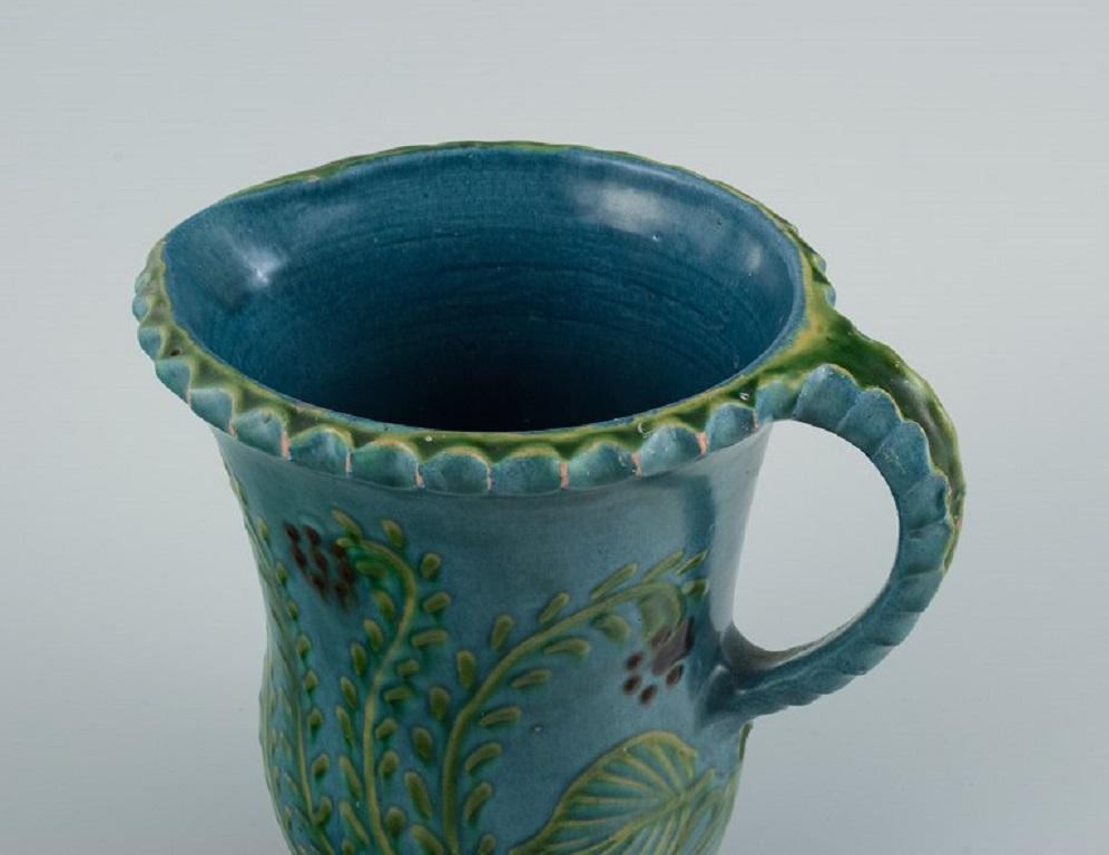 Danish Kähler Jug in Glazed Ceramic, Decorated with Flowers on a Blue Background