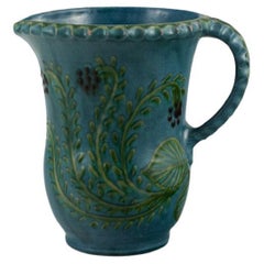 Kähler Jug in Glazed Ceramic, Decorated with Flowers on a Blue Background