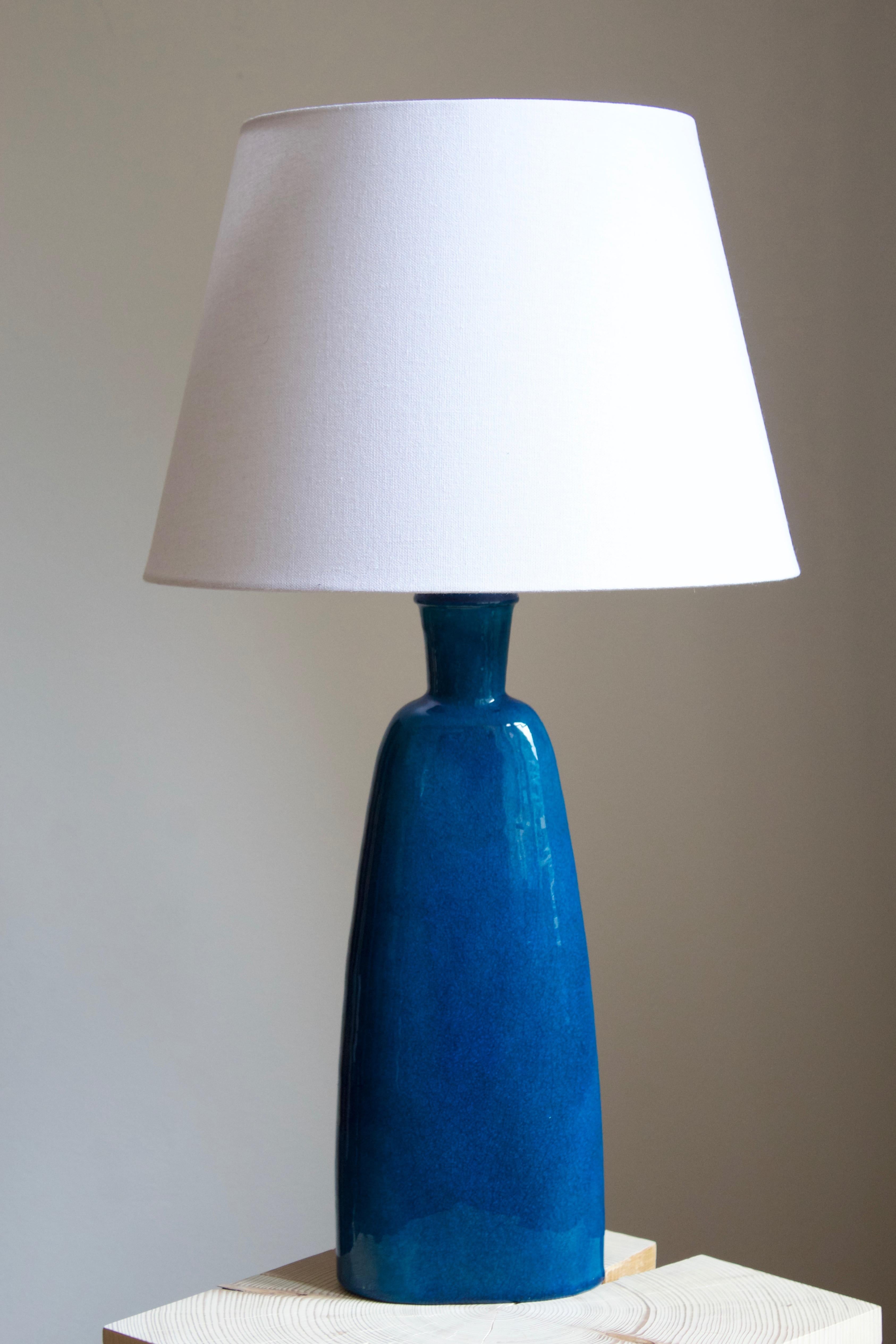 A large table lamp, designed and produced by Kähler, Denmark, c. 1930s. Labeled and marked.
  
Stated dimensions exclude lampshade. Height includes socket. Sold without lampshade.