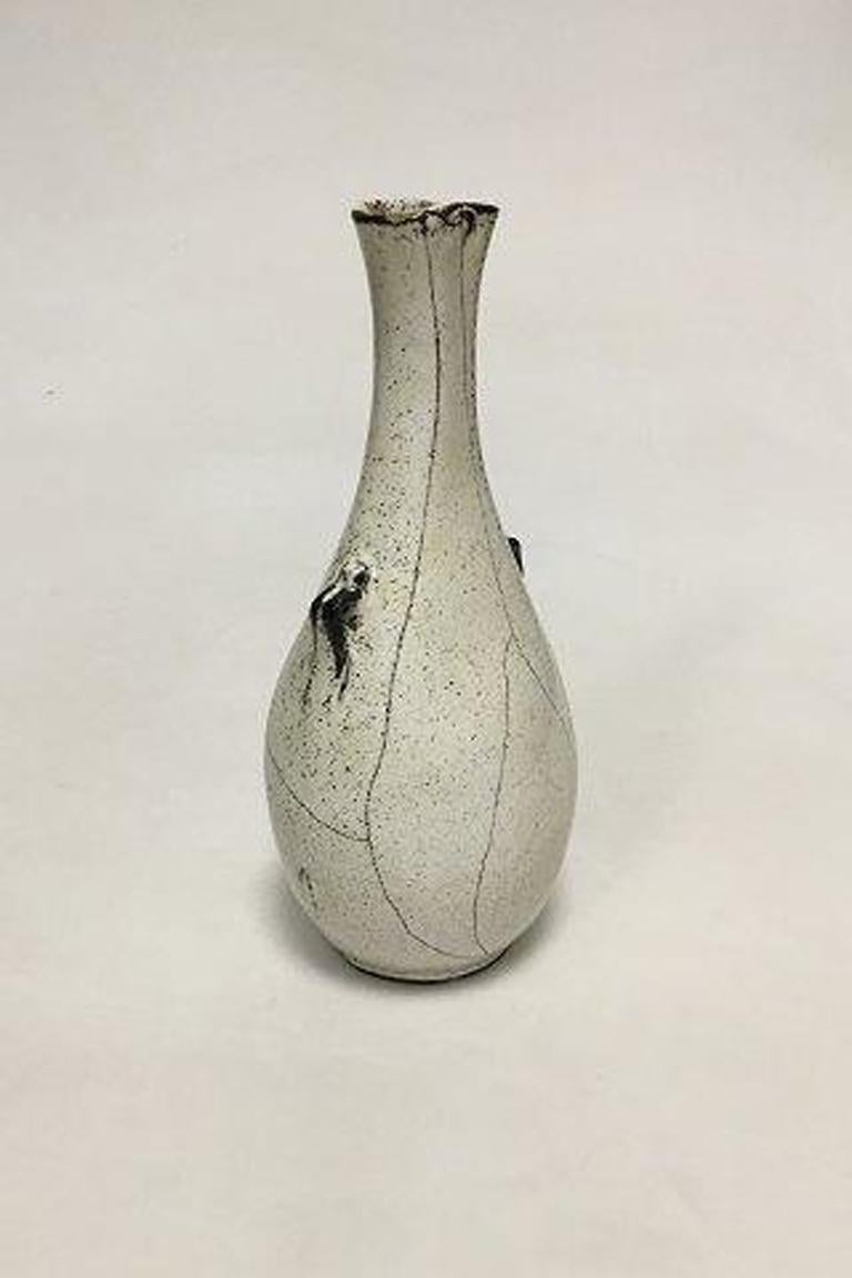 Kähler stoneware vase with white/black decoration. Designed by Svend Hammershøi. 

Measures 20 cm / 7 7/8 in. Some minor chips on top and bottom.