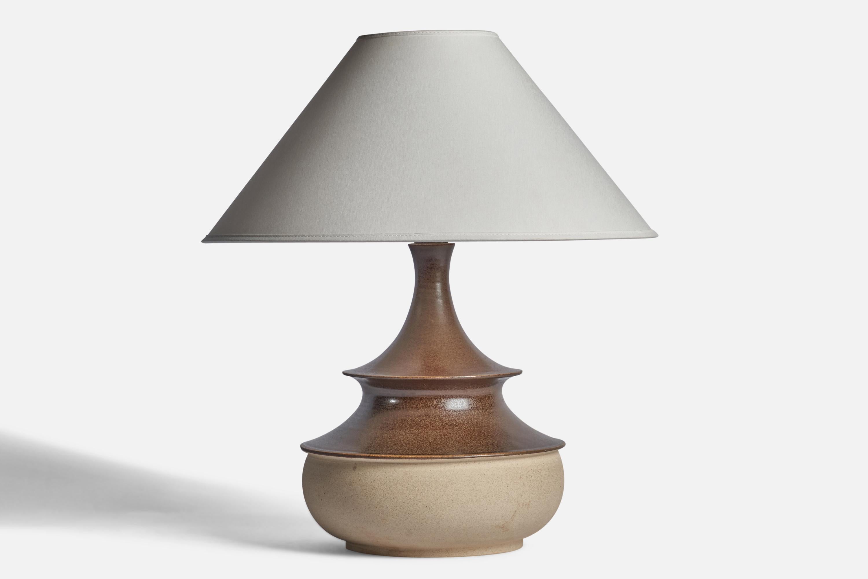 A brown and beige semi-glazed stoneware table lamp designed and produced by Kähler, Denmark, 1950s.

Dimensions of Lamp (inches): 13.25 H x 9.25” Diameter
Dimensions of Shade (inches): 4.5” Top Diameter x 16” Bottom Diameter x 7.25” H
Dimensions of