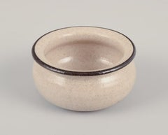 Kähler. Three small ceramic bowls. Glaze in sandy tones with a black edge.