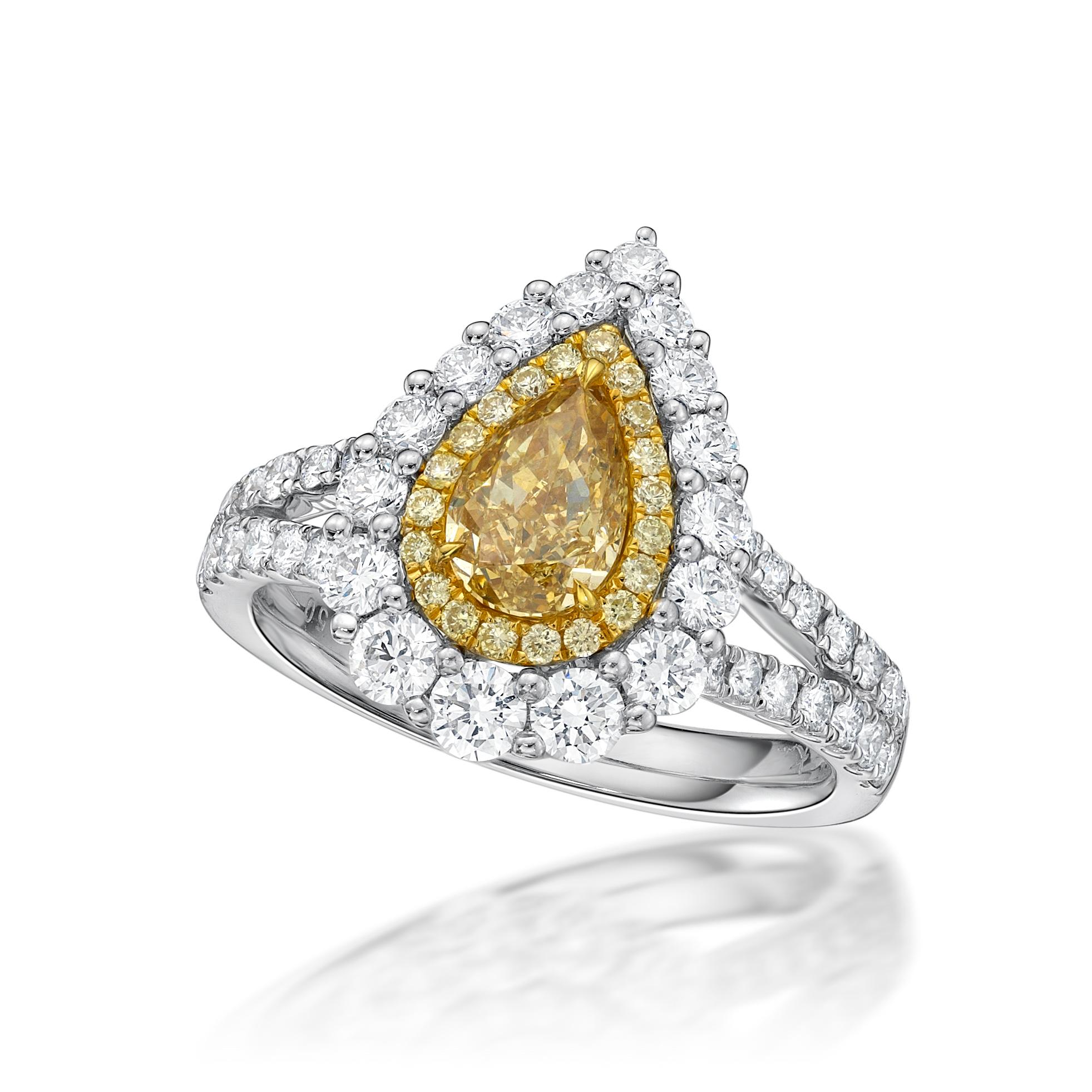 Featuring a 1.01 carat Fancy Brownish Yellow Diamond Ring , with yellow diamond and white diamond halo. Finished in white gold. 

Center stone certified by world wide known GIA institution. Ring size- US 6. (1199983424)
CENTER DIAMOND : 1.01CT
WHITE