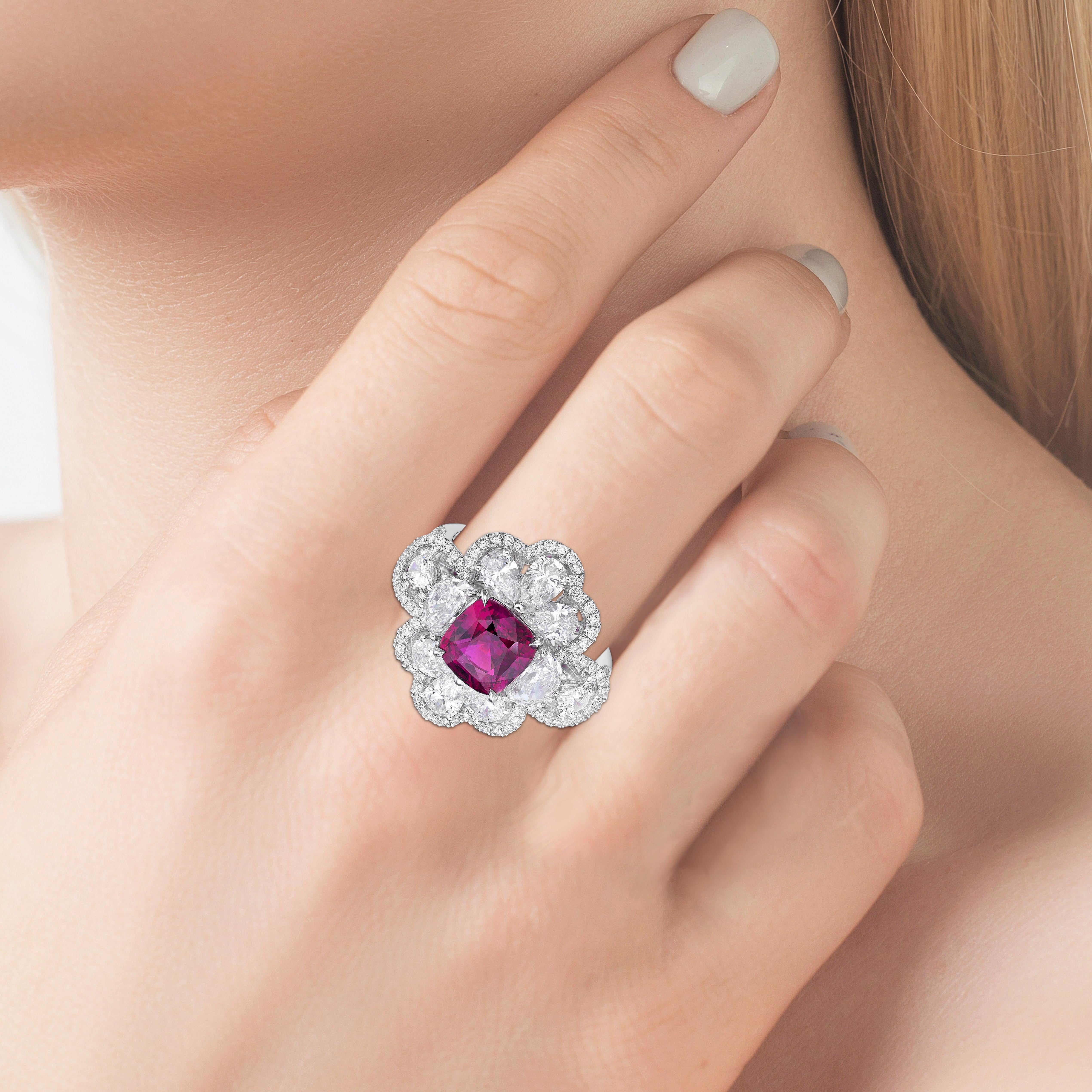 This beautiful ring present a 3.11 carat UNHEATED vivid purplish PINK sapphire from Mozambique set with white diamond in pear and round,  finished in white gold. 

3 carat above Exceptional certified natural unheated cushion pink sapphire from