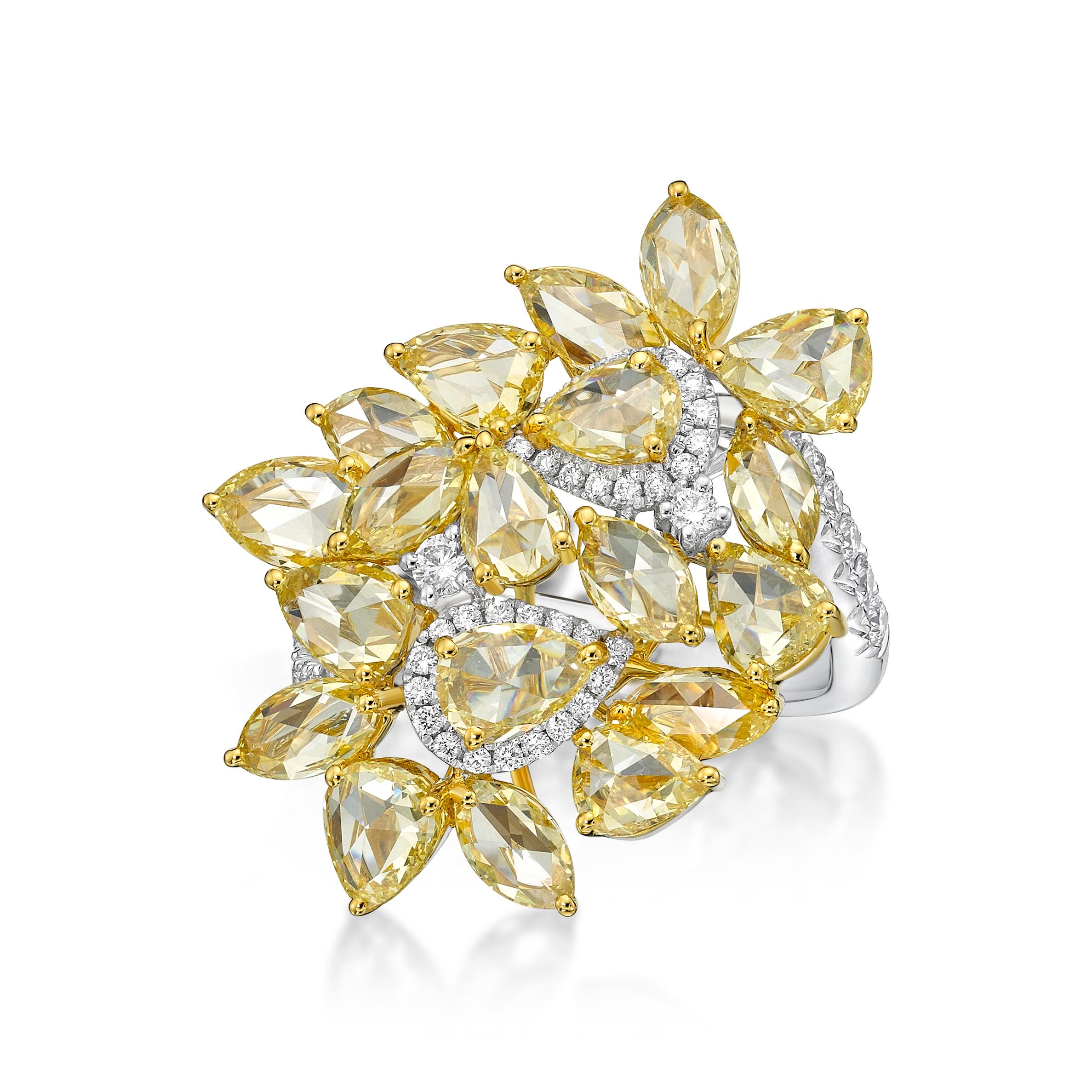 pear and marquise shape of the yellow diamond cluster to create this ring, Designer imagine the rose cut yellow diamond as the petal of the flower and clustered around with the center one with a halo to outline the subject. A total of 19 pcs of