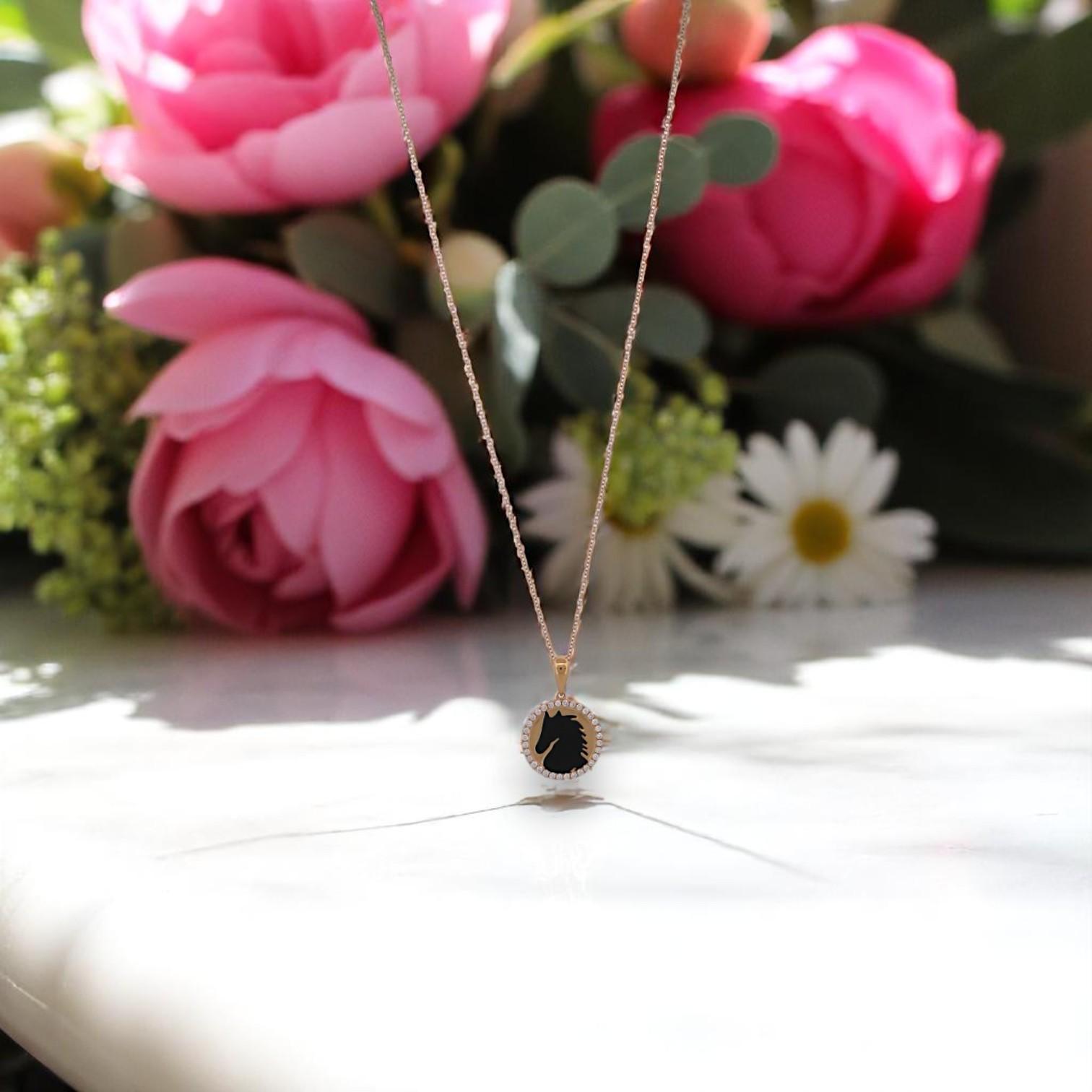 Fierce. Elegant. One of a kind. The Kai Necklace by Mountain Song Jeweler is a statement of power and grace. This standout piece features a 1.89 carat Black Onyx disc inlaid with a regal 18k yellow gold horse head cutout, symbolizing strength,