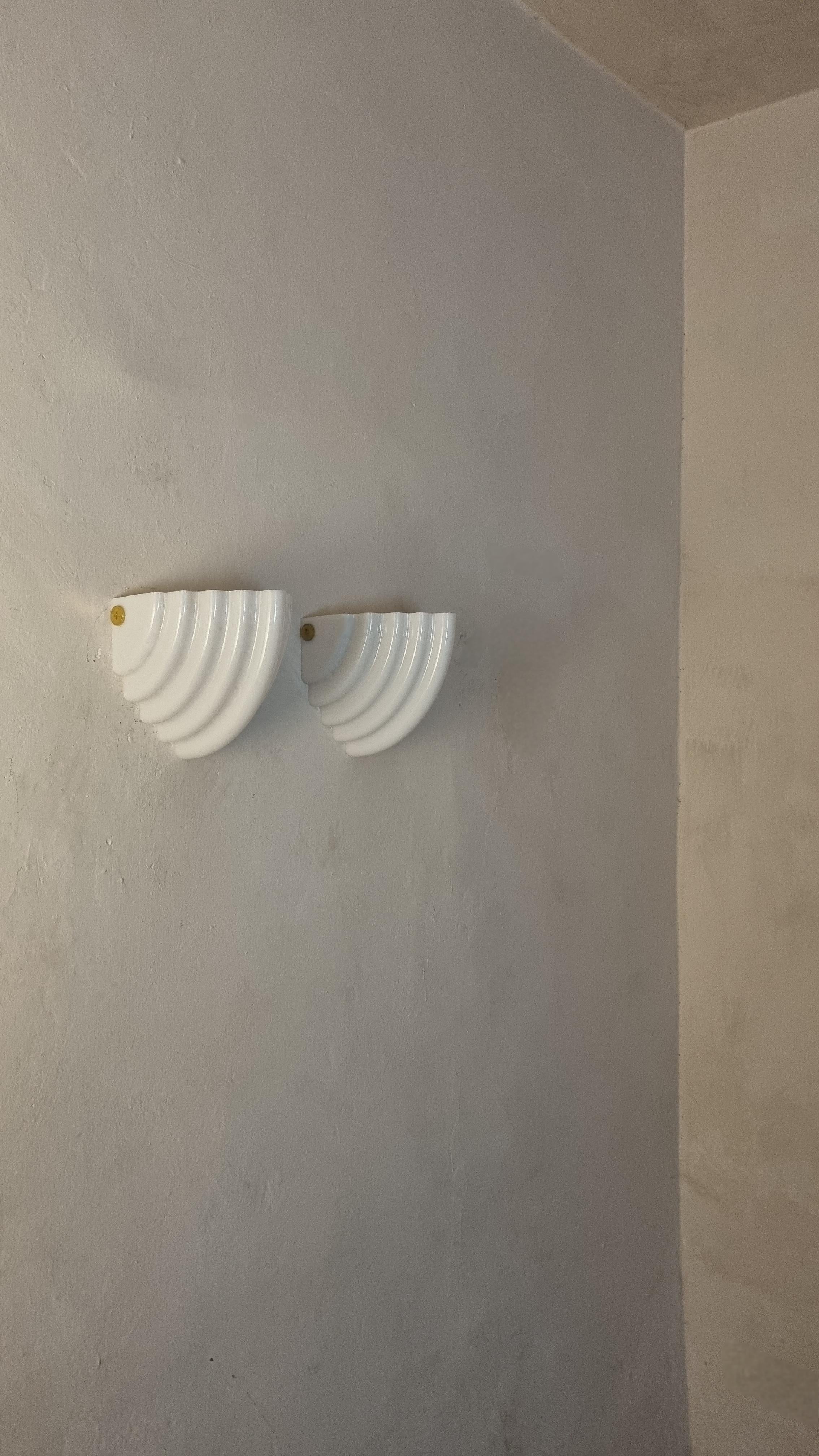 Kai 2 Wall sconces designed by  Kazuhide Takahama for Sirrah, Italy 1980s.
Acrylic structure, metal, excellent condition.

Kazuhide Takahama (1930 - 2010) was born on the Japanese island of Kyushu. In 1953 he graduated from the Tokyo Institute of