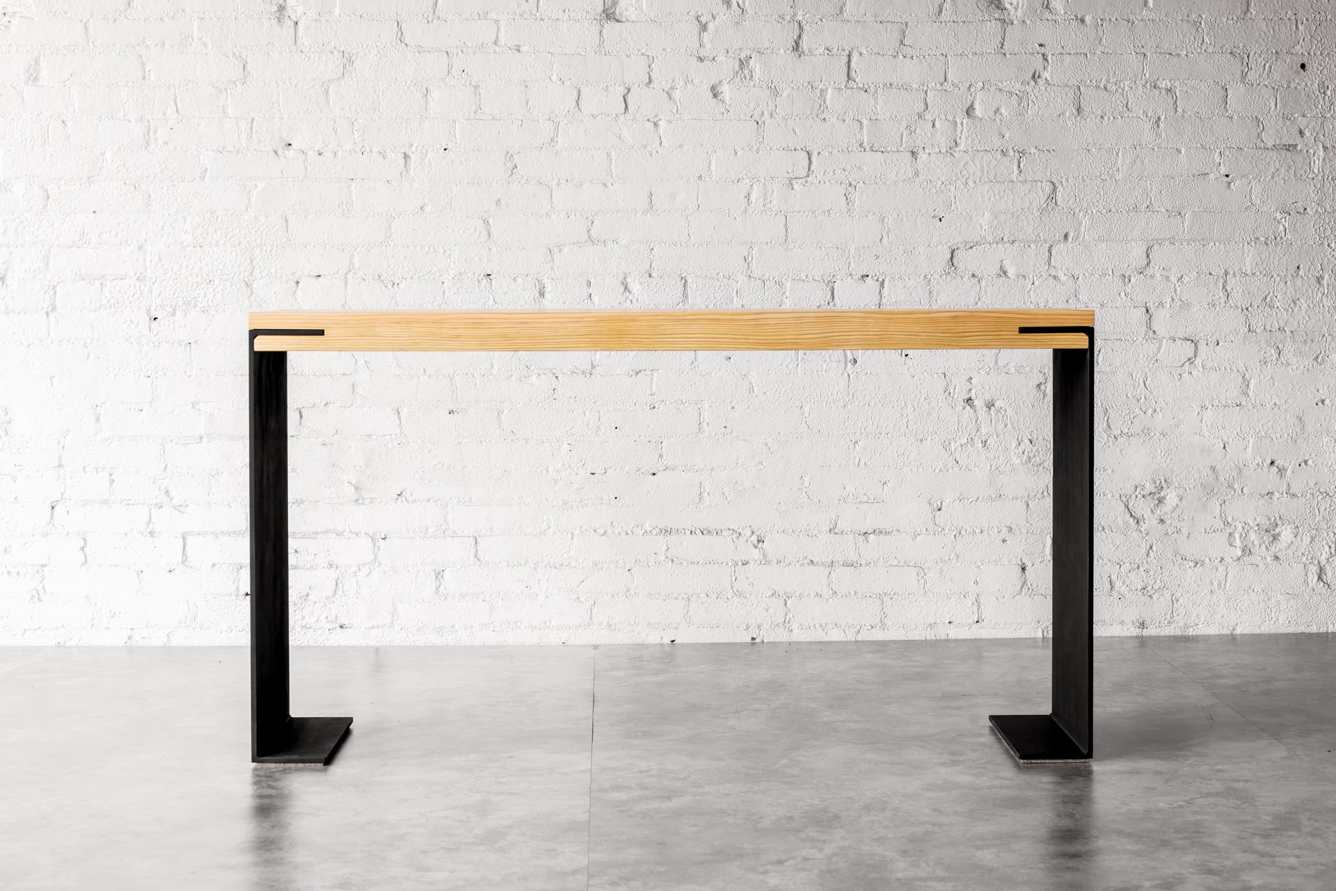 The Kai Console by Autonomous Furniture is the perfect embodiment of modern industrial design. Crafted by designer Kirk Van Ludwig, this stunning piece combines the beauty of Douglas Fir wood with the boldness of matte black steel legs.

With its