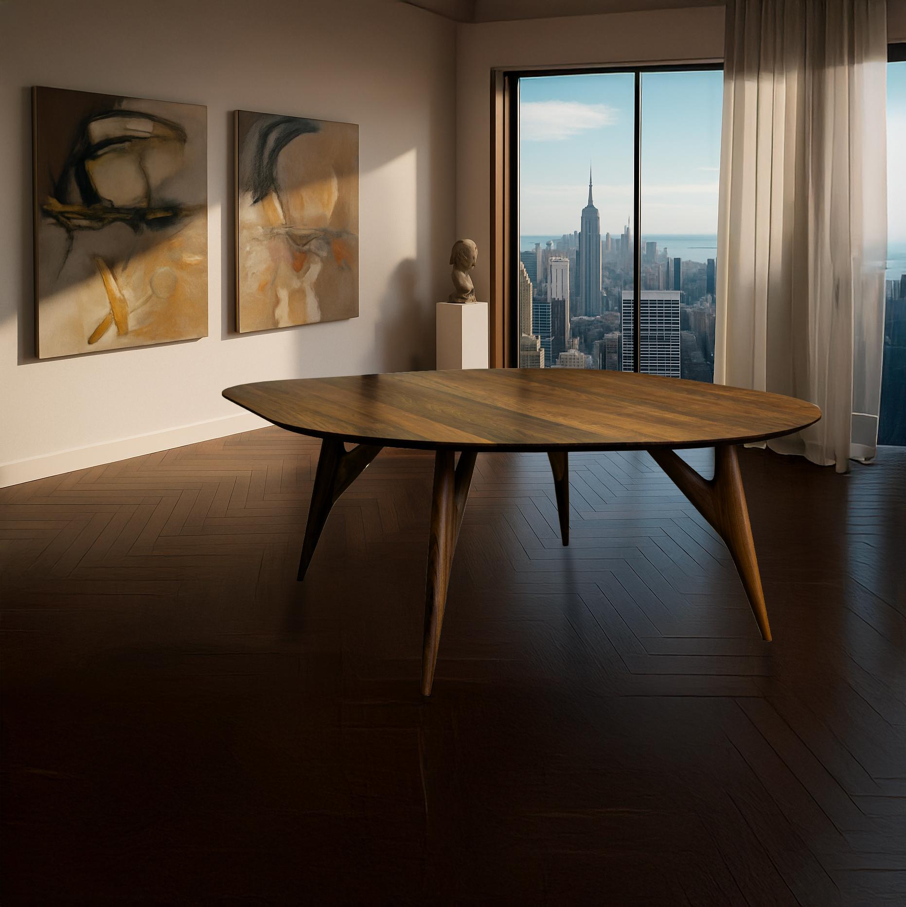 The Kai Dining Table by Greyge is a sculptural Italian masterpiece, handcrafted in solid walnut with a distinctive four-leg structure. Designed to balance elegance and strength, its organic lines highlight the natural beauty of wood while