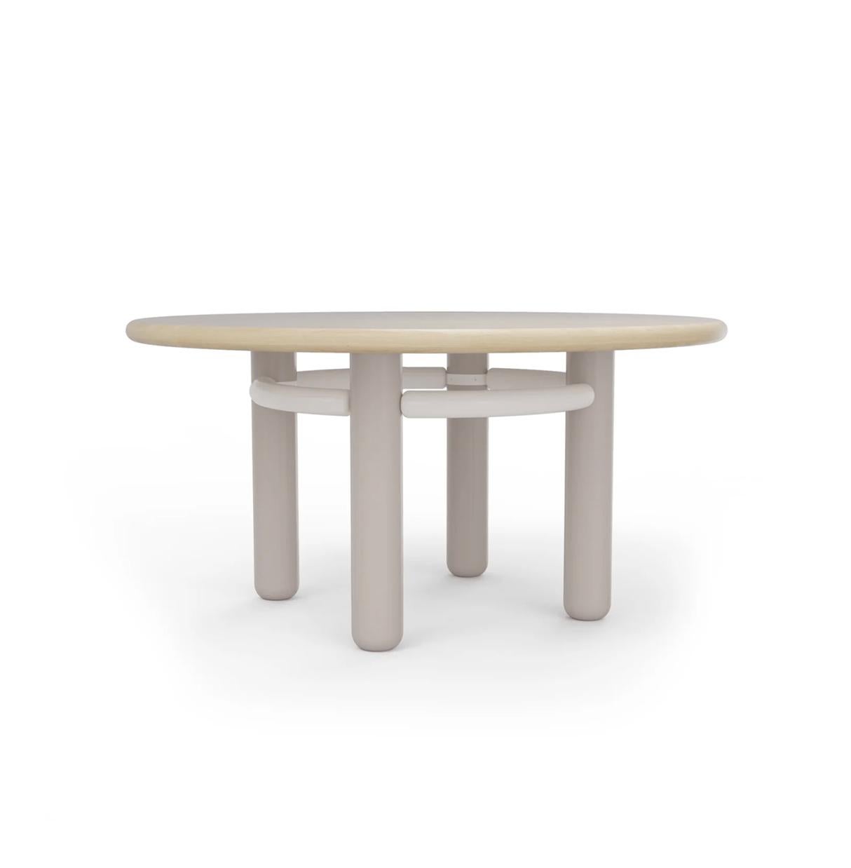 KAI dinner table with lacquered wood feet, oak wood top and steel structure
150cm diameter 
The feet, the structure and the top are available in a selection of curated materials and finishings from our collection. Completely customisable to each