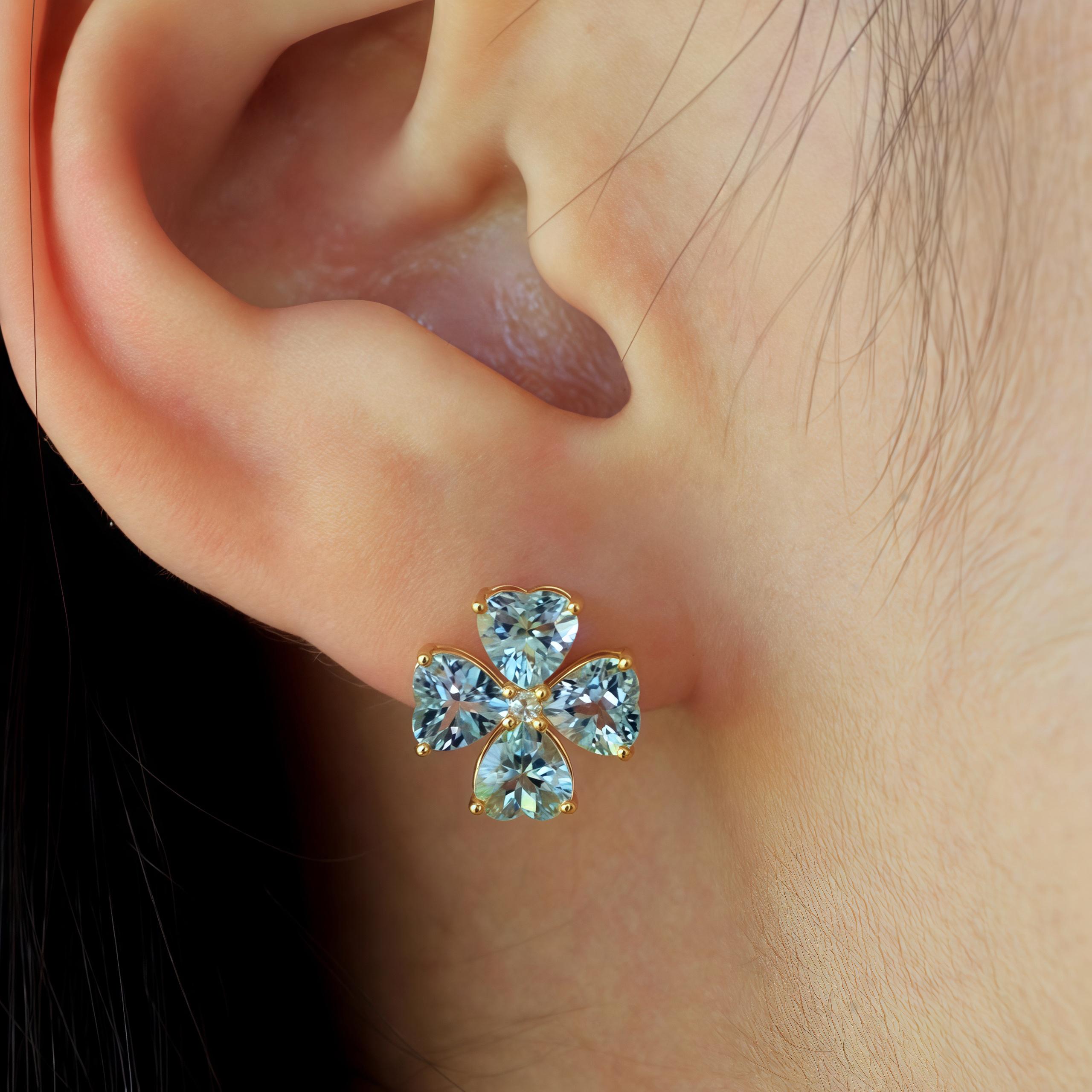 Kai Fine Jewelry's Felicia Aquamarine Diamond Clover Earrings in 14K solid gold offer an enchanting blend of luxurious charm and craftsmanship. Each earring is adorned with heart-shaped natural aquamarines, forming a four-leaf clover design