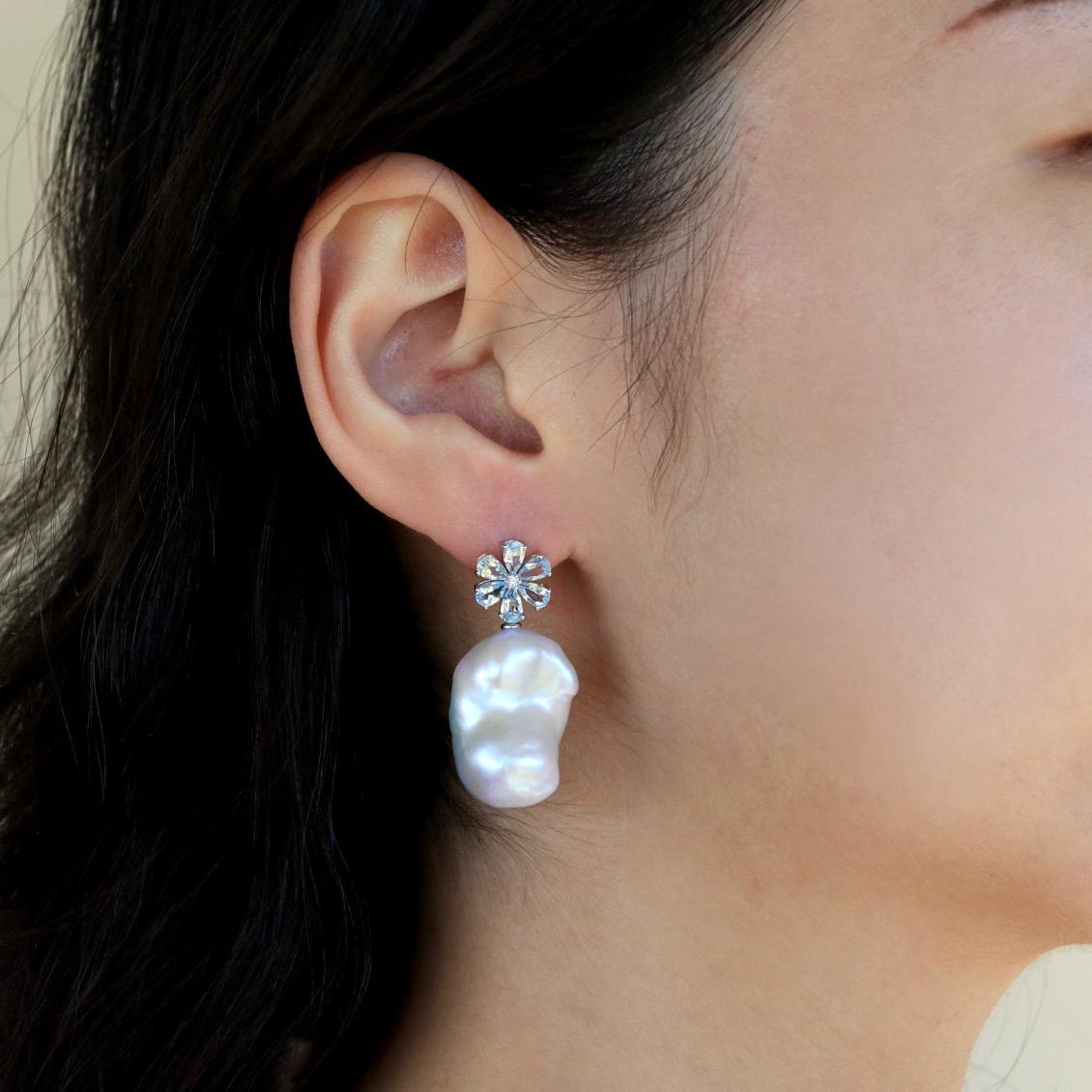Aquamarine has long symbolized clarity, courage, and inner peace, making these earrings not just a fashion statement but a piece with deep meaning. Explore the serene beauty of Aquamarine and embrace the uniqueness of baroque pearls by adding this