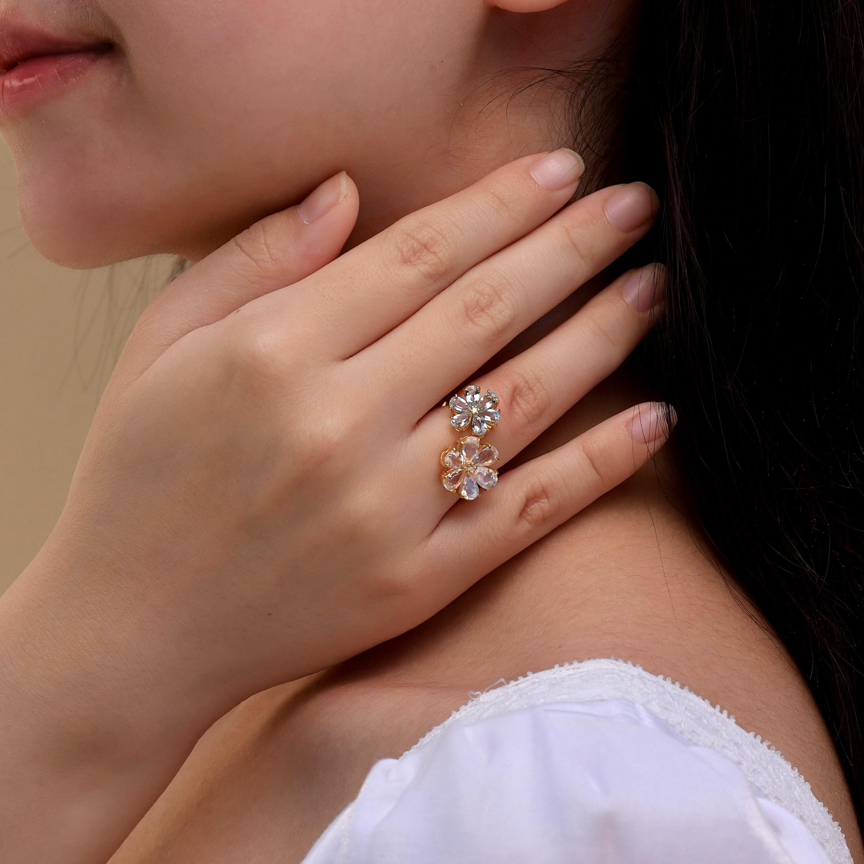 Kai's Flora Blossom Moonstone and Aquamarine Toi et Moi Ring is a breathtaking expression of nature’s beauty and the timeless bond of love. This ring showcases two enchanting blossoms—one crafted from glowing moonstone and the other from serene