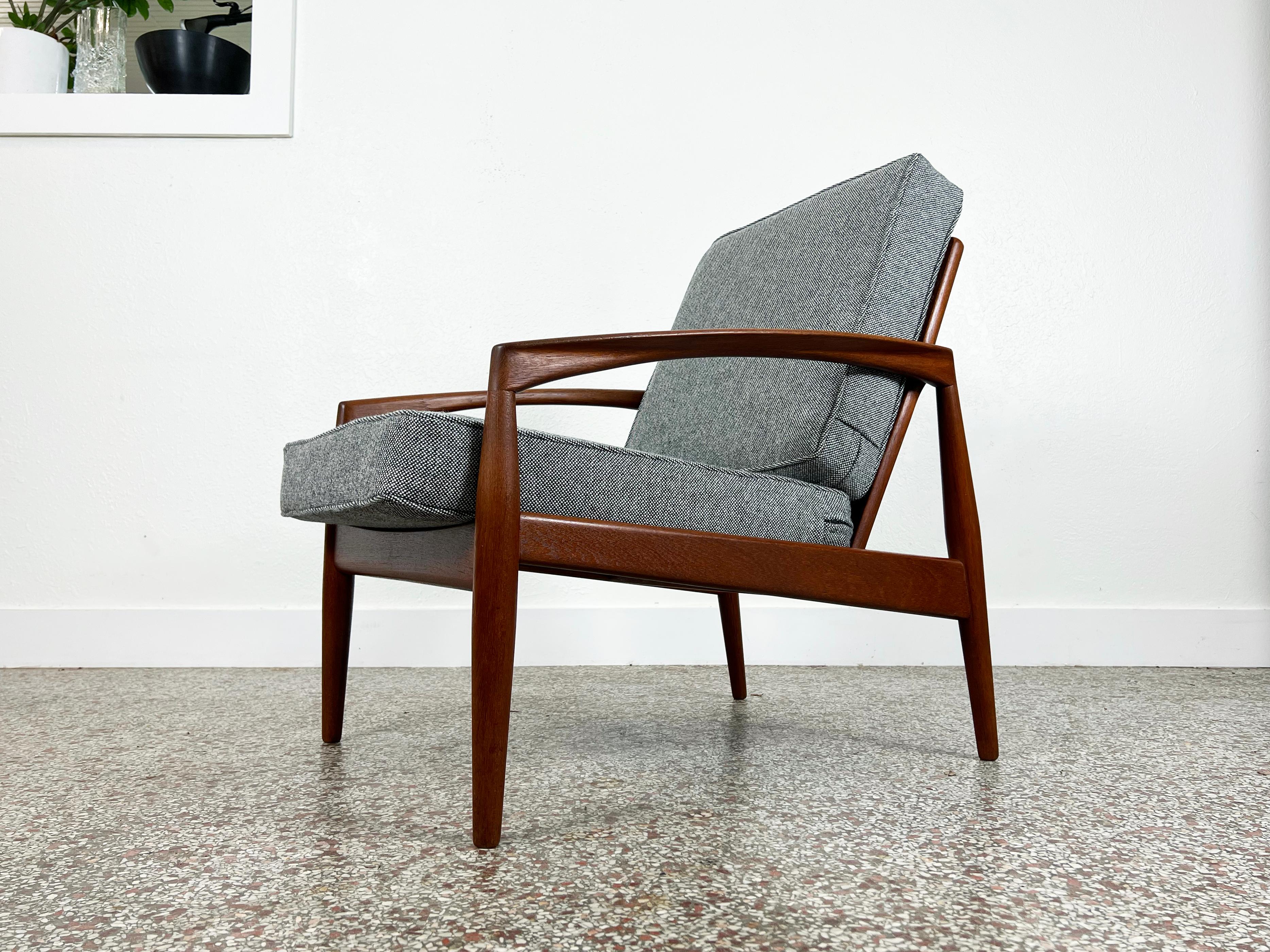 Vintage 'Paper Knife' chair in teak by Kai Kristiansen for Magnus Olesen. Cushions have been newly upholstered in a vintage grey Maharam Hallingdal wool textile by Nana Ditzel. Marked 'Made in Denmark' on frame. 

Designer: Kai