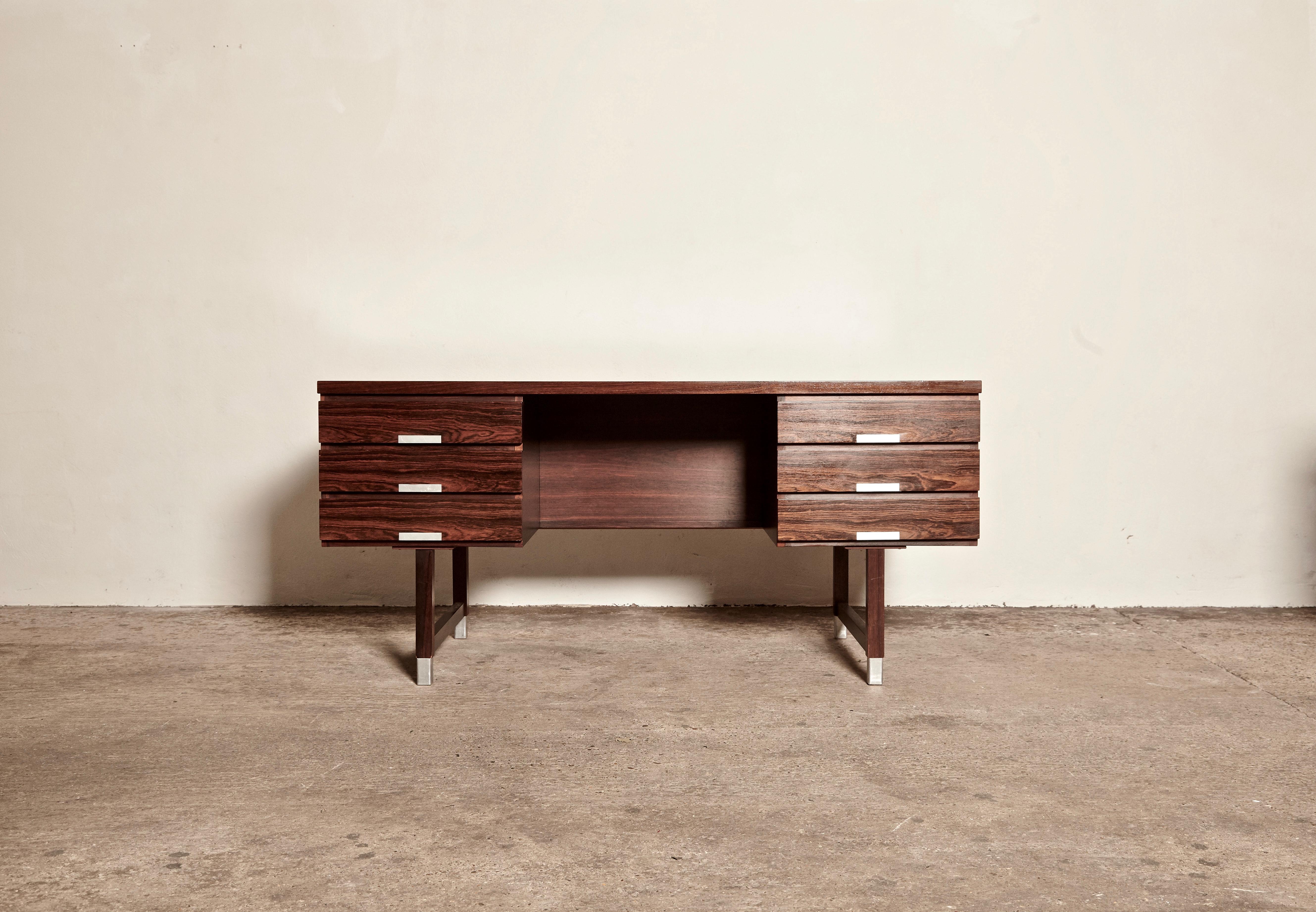 Midcentury rosewood writing desk by Kai Kristiansen, for Schou Andersen Møbelfabrik, 1960s, Denmark. Front with six drawers, reverse side with shelves. Aluminium handles and shoes. In good original condition, some minor indentations (possibly from a