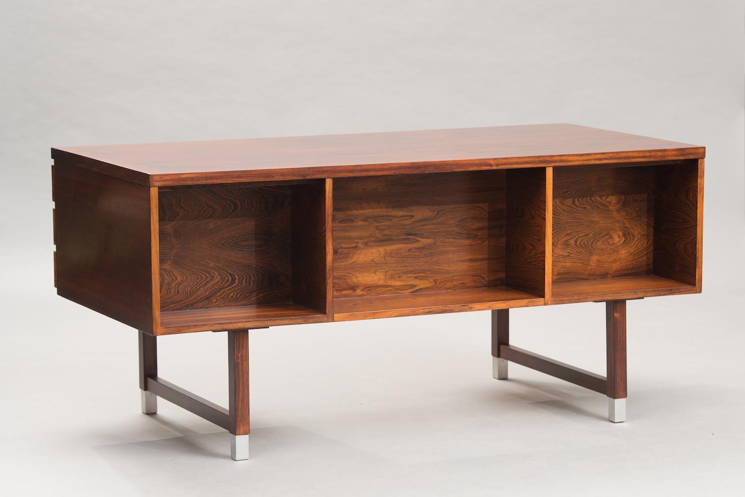 Rosewood and aluminum desk with six drawers.