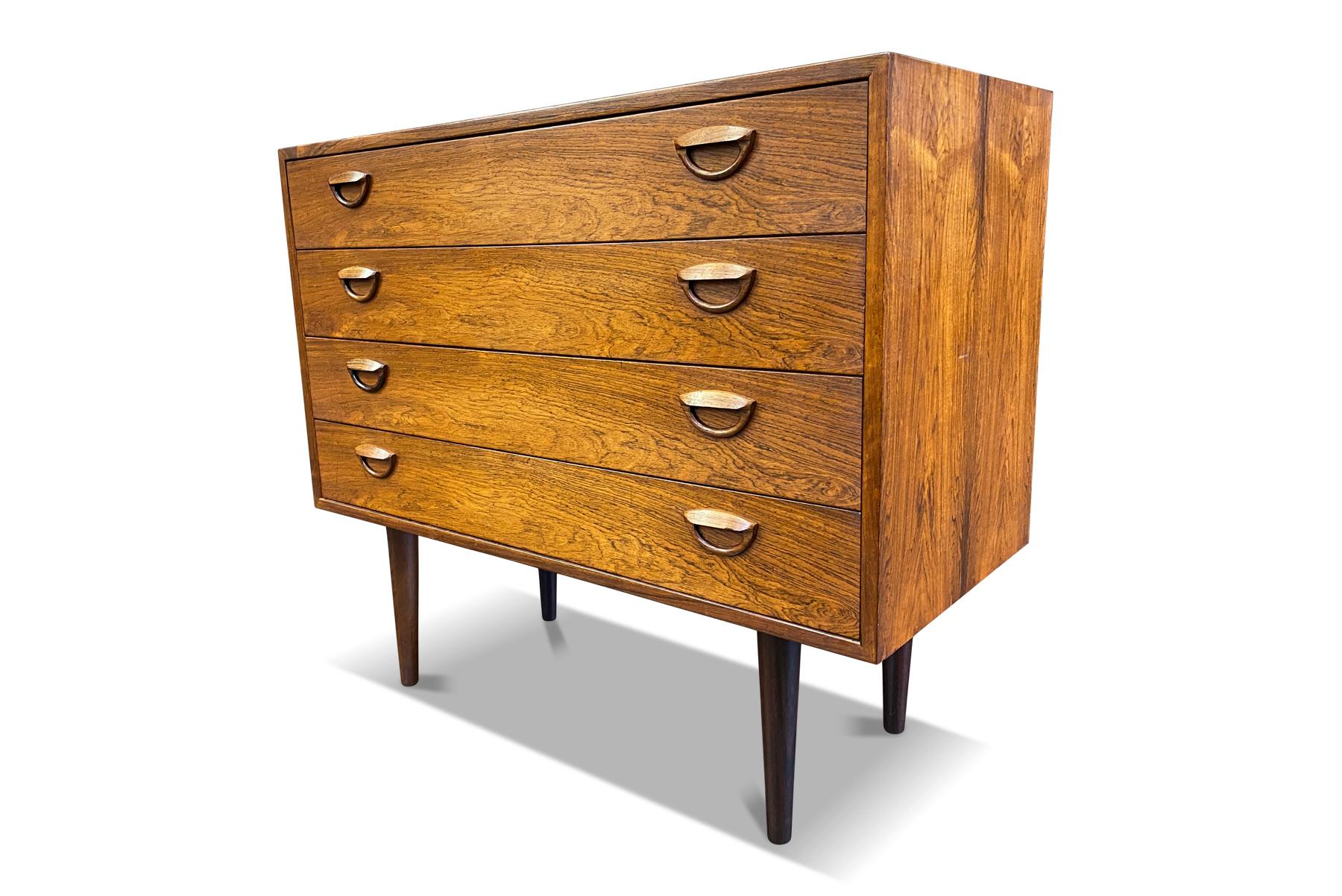 This handsome Danish modern Kai Kristiansen for Feldballes Møbelfabrik gentleman’s chest in Brazilian rosewood offers excellent storage. The four drawers are adorned with the designer’s signature “eye” pull. In excellent original