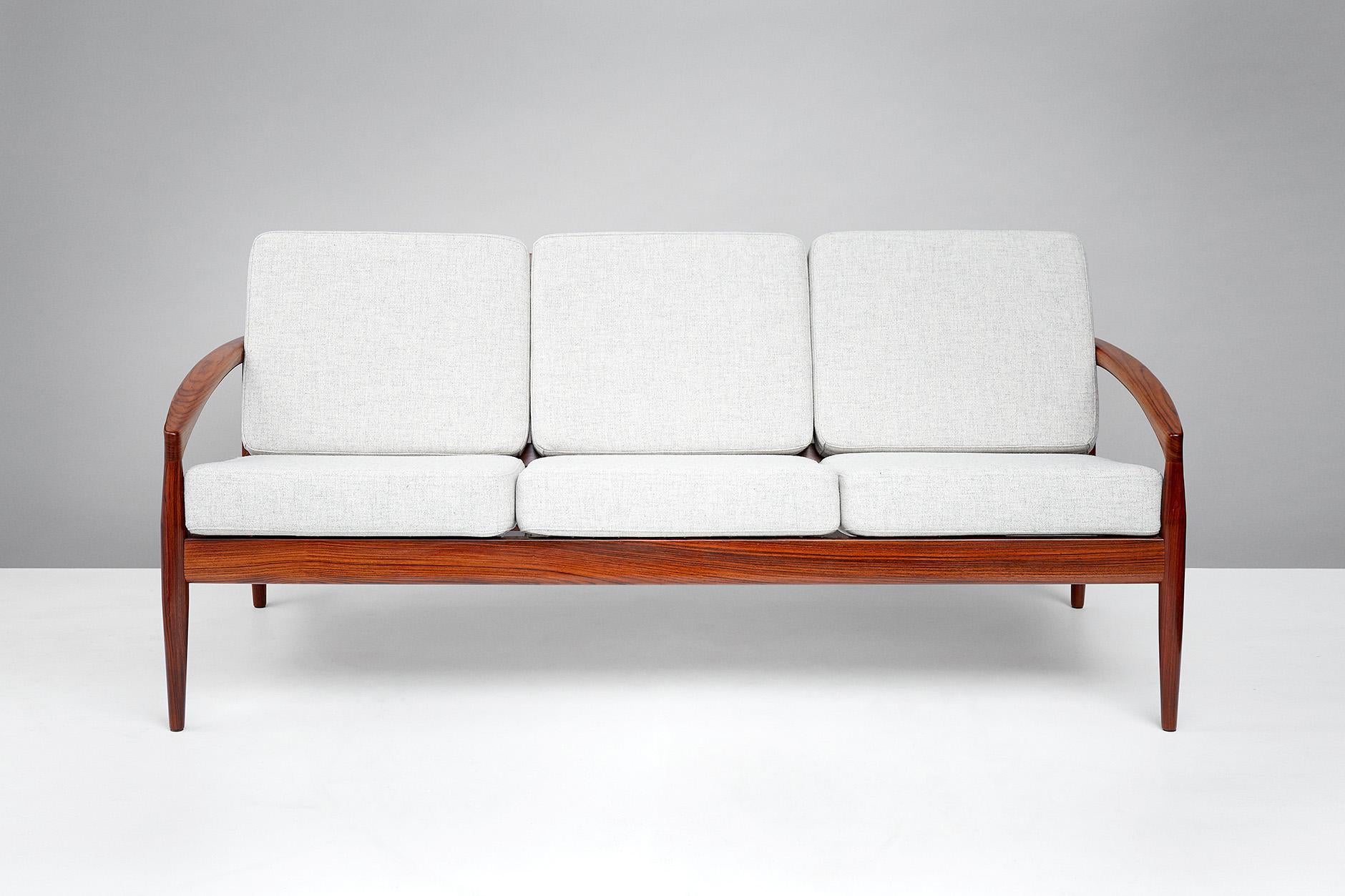 Kai Kristiansen.

Paper Knife sofa, 1955.

Produced by Magnus Olesen, Denmark. Rarely seen example of the three person sofa made from rosewood. New cushions covered in Kvadrat Tonica wool fabric.