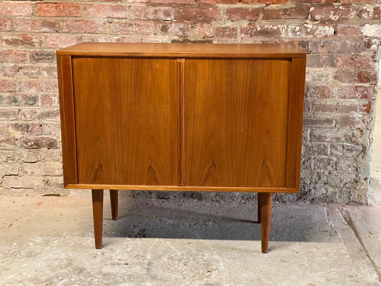 Kai Kristiansen Danish Modern teak tambour door record cabinet. Fits an ample amount of your vinyl. Kai Kristiansen for FM Mobler. Very good condition and finish. Circa 1960-70. Recently purchased from the estate of an economics professor at Cornell