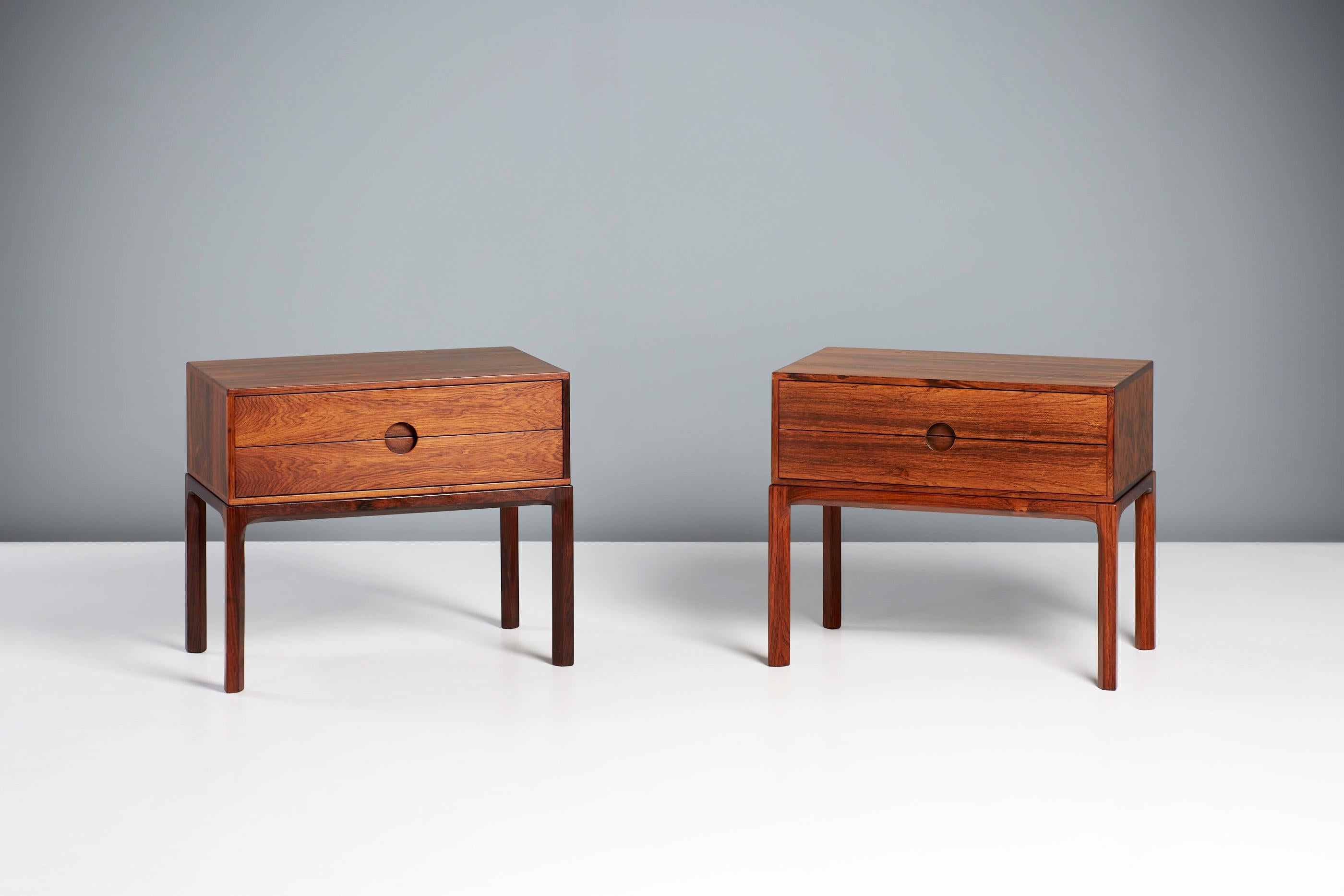 Kai Kristiansen - Model 384 Rosewood Nightstands, c1950s

A pair of exquisite rosewood bedside cabinets, produced by cabinetmaker Aksel Kjaersgaard in Odder, Denmark circa 1950s. This design was part of Kai Kristiansen's iconic 'Entre' series of
