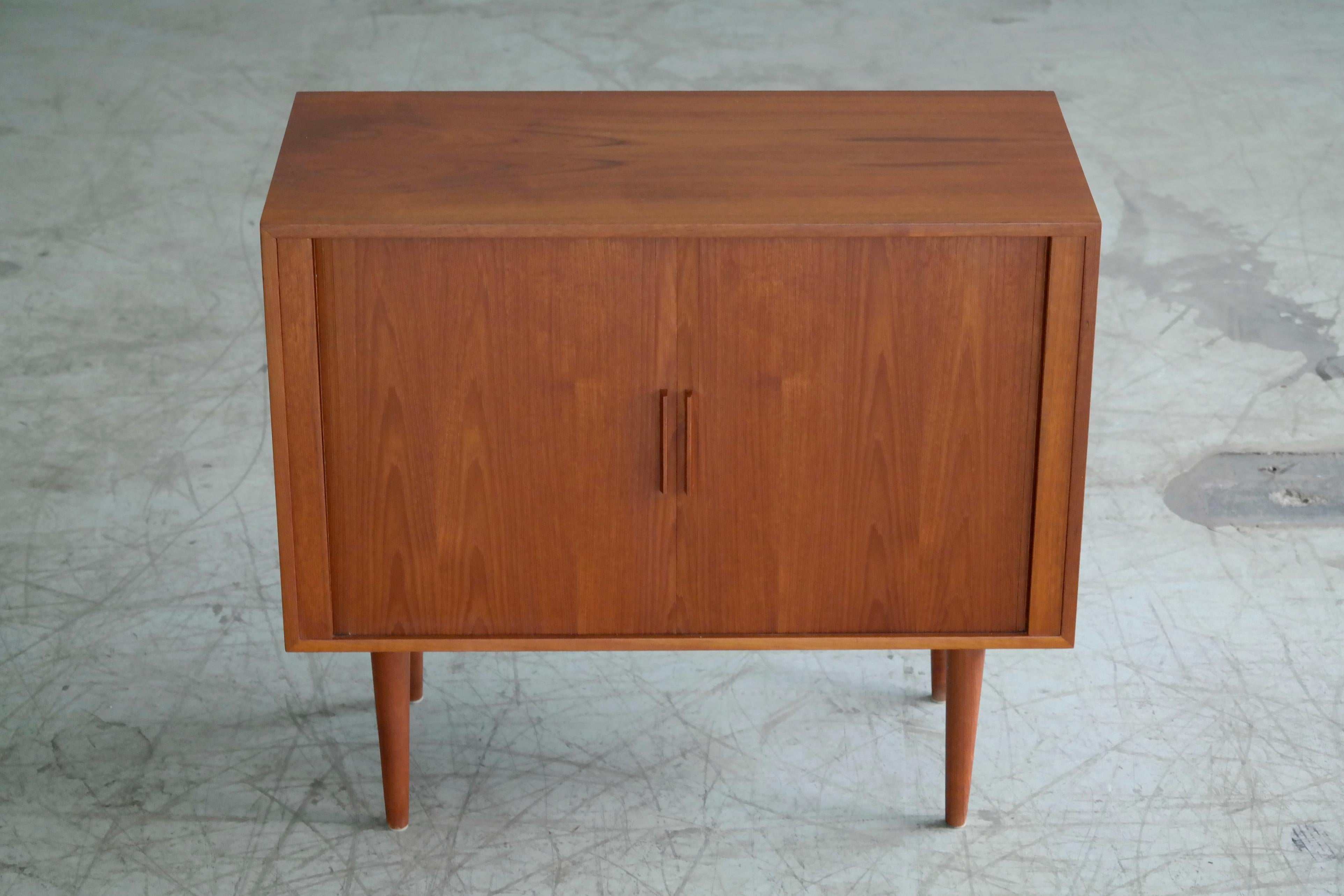 Very nice and elegant 1960s teak sideboard and media console designed by Kai Kristiansen. Inside shelves have inserts for organizing and storage of vinyl records. However, these inserts are removable and adjustable hence the piece can function as