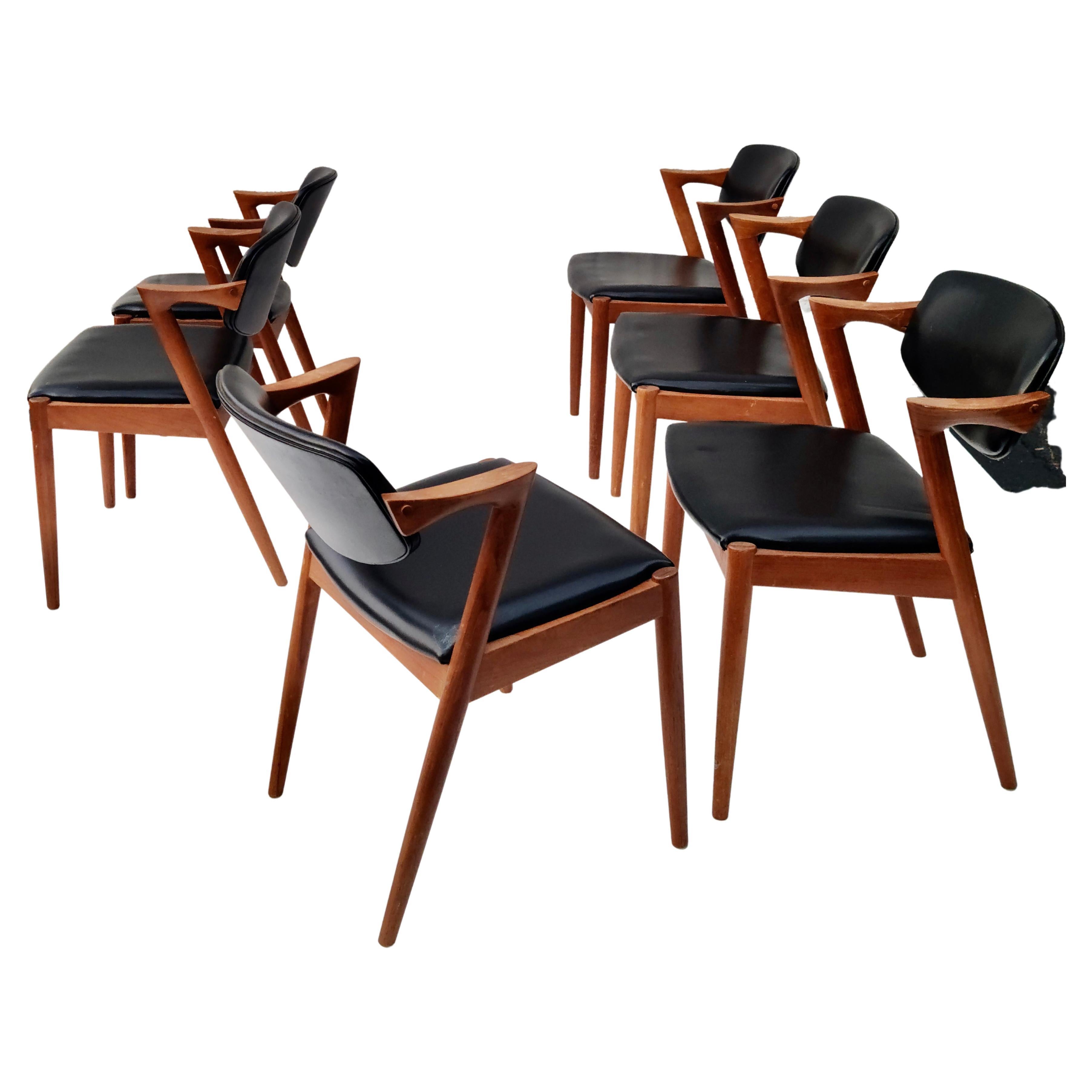 Please feel free to reach out for accurate shipping to your location.

Set of six Dining chairs by Kai Kristiansen.
Sculpted Teak construction.
Made in Denmark.
