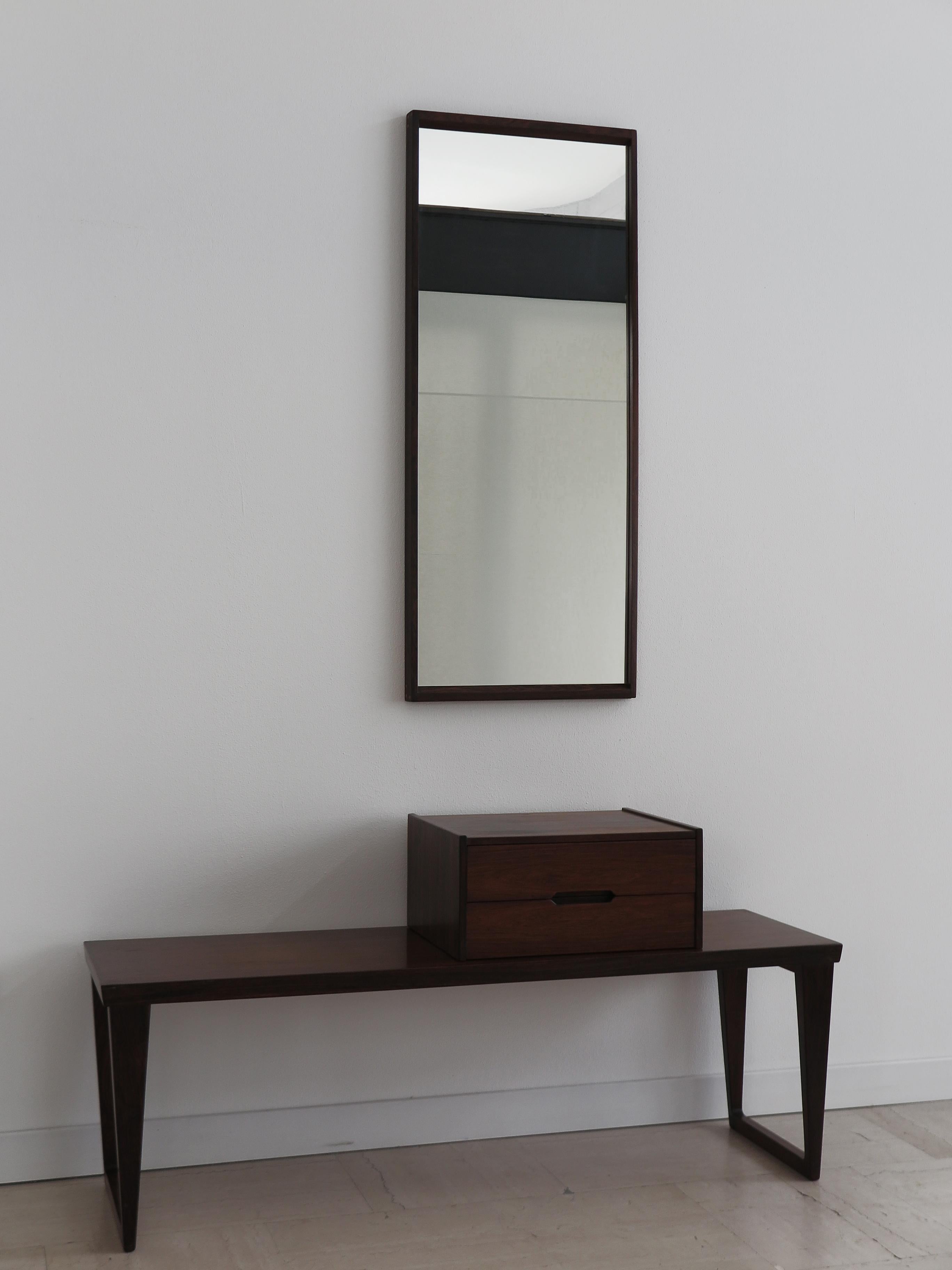 Scandinavian, vintage modern antique set for hallway or bedroom consisting of movable chest of drawers, coffee table and mirror in dark wood designed by Kai Kristiansen and produced by Aksel Kjersgaard, with mark printed on back of chest of drawers
