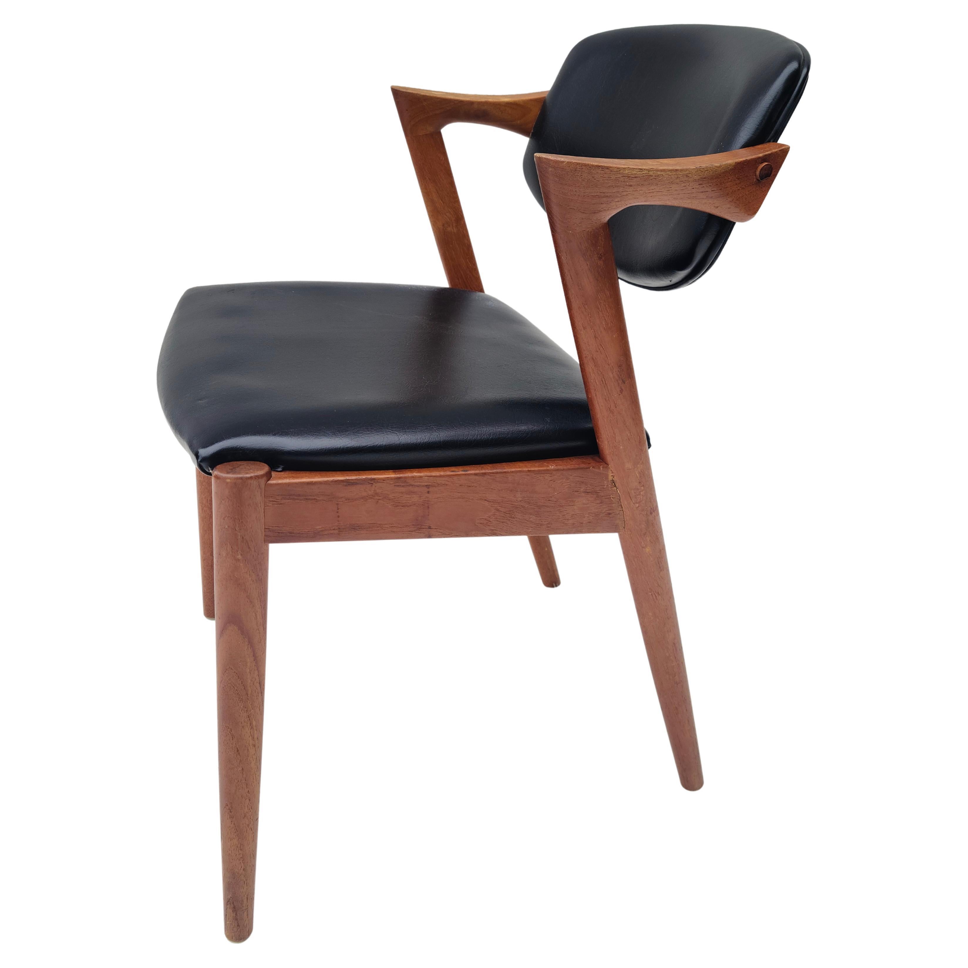 Please feel free to reach out for accurate shipping to your location.

Dining chair by Kai Kristiansen.
Sculpted Teak construction.
Made in Denmark