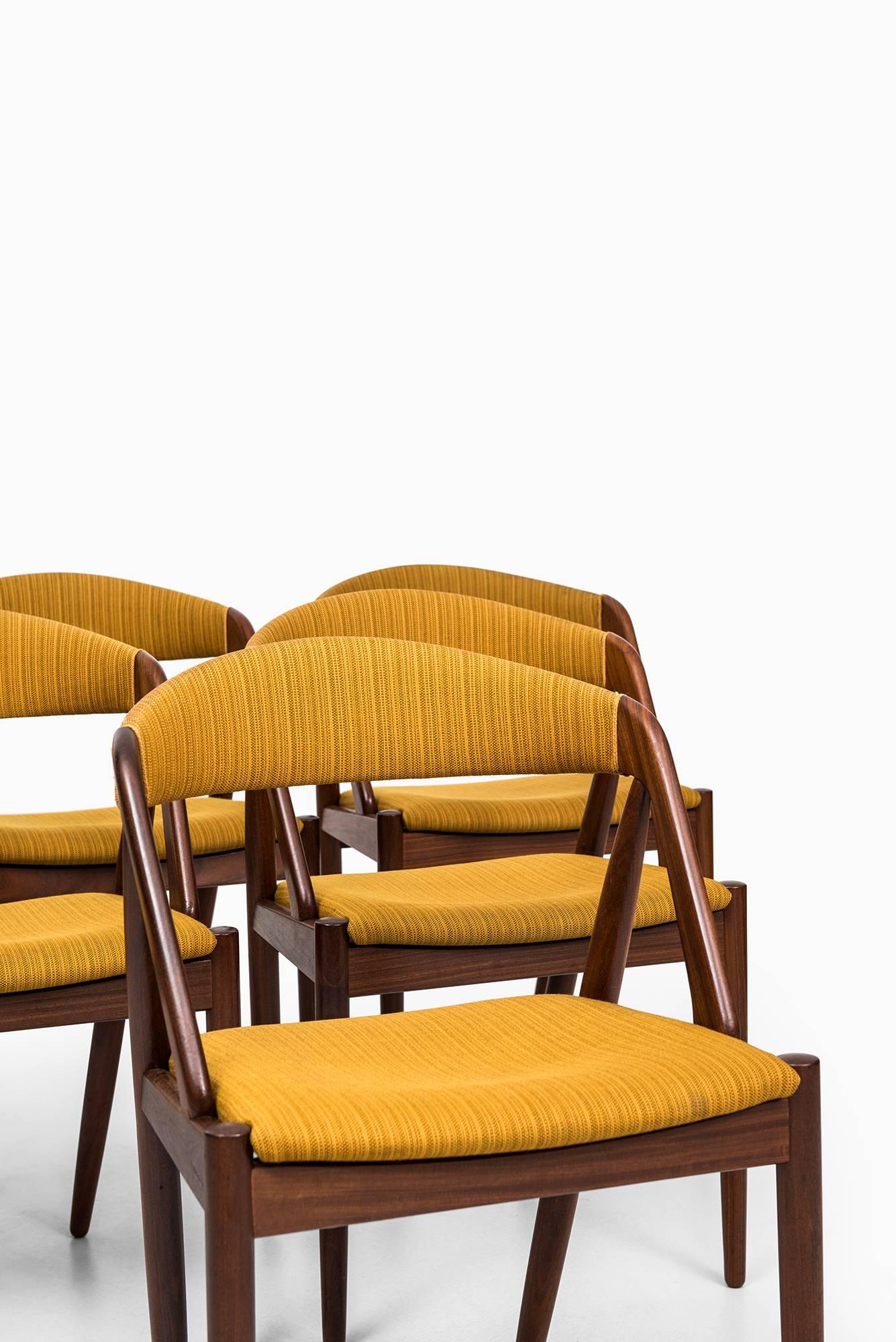 Set of six dining chairs designed by Kai Kristiansen. Produced by Schou Andersen in Denmark.