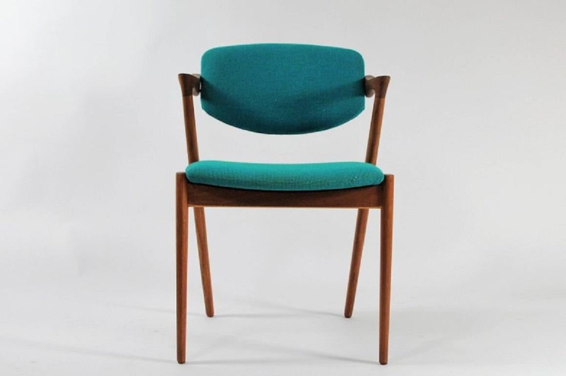 Set of eight fully restored, 1960s teak dining chairs by Kai Kristiansen for Schous Møbelfabrik.

The chairs have Kai Kristiansens typical light and elegant design that make them fit in easily where you want them in your home - a design that was so