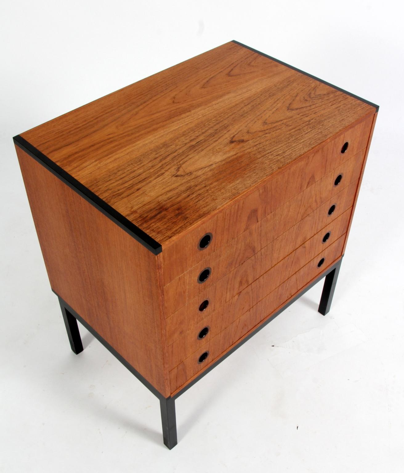 Kai Kristiansen for Aksel Kjersgaard, attributed, dresser with 5 drawers.

Made of teak and ivory tree. Handles of rosewood.

Base of black laquered steel.

Fantastic drawer with impressive details. 

One minor professional repair.