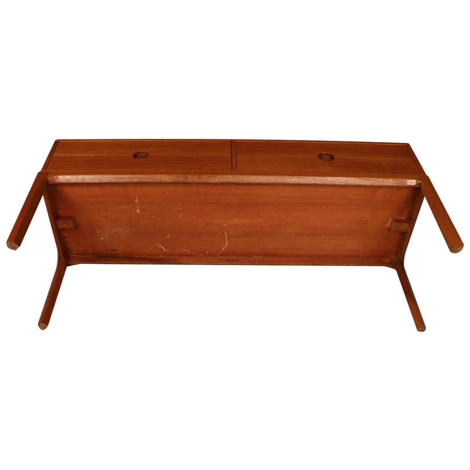 Remarkable iconic teak sideboard / low bench, or side table rare, model no. 394, designed by famous Danish designer Kai Kristiansen for Aksel Kjersgaard, in Denmark. Designed in 1954-1955 and in production until 1963-1964. Features a lovely low