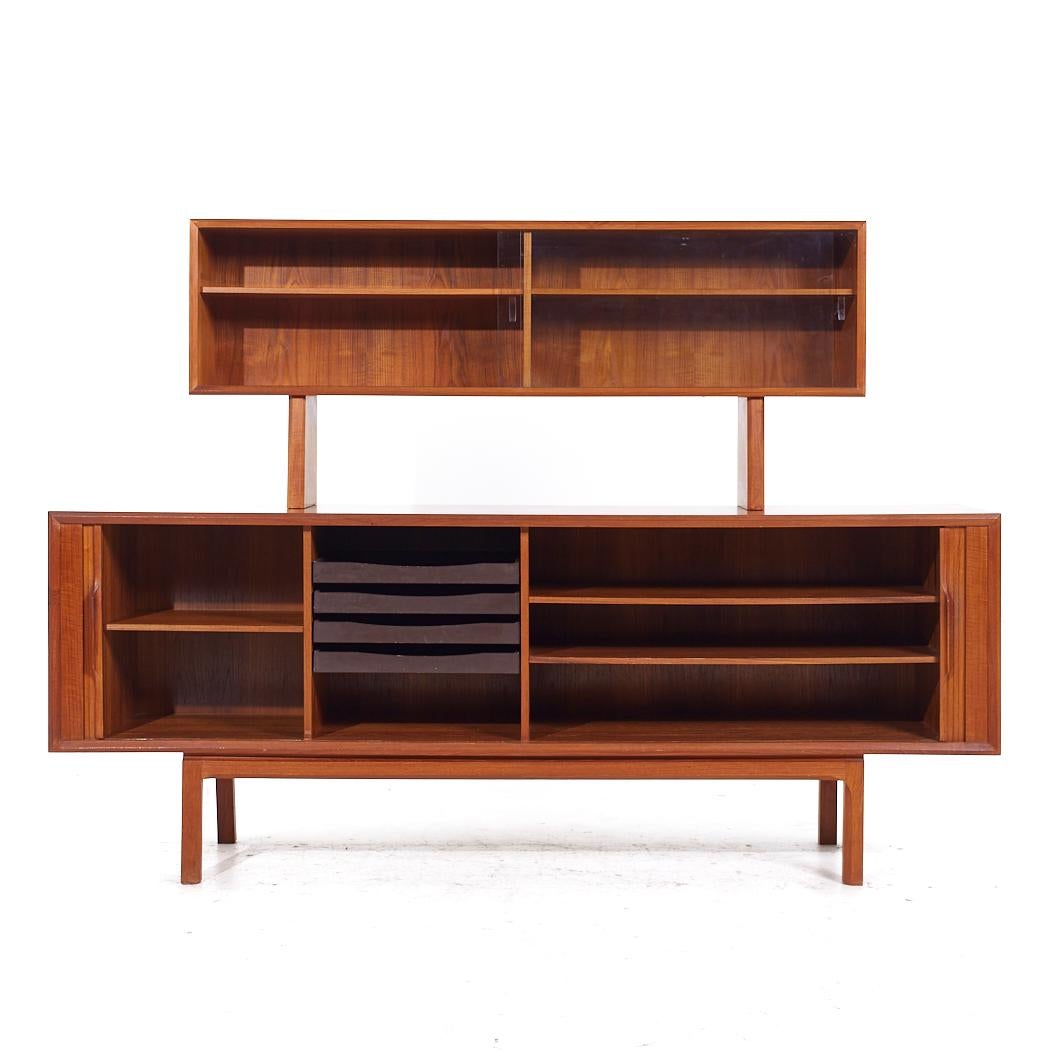 Kai Kristiansen for Faarup Møbelfabrik Mid Century Danish Teak Tambour Credenza and Hutch

The credenza measures: 79.75 wide x 19 deep x 31.25 inches high
The hutch measures: 59 wide x 11.25 deep x 25.25 inches high
The combined height of the