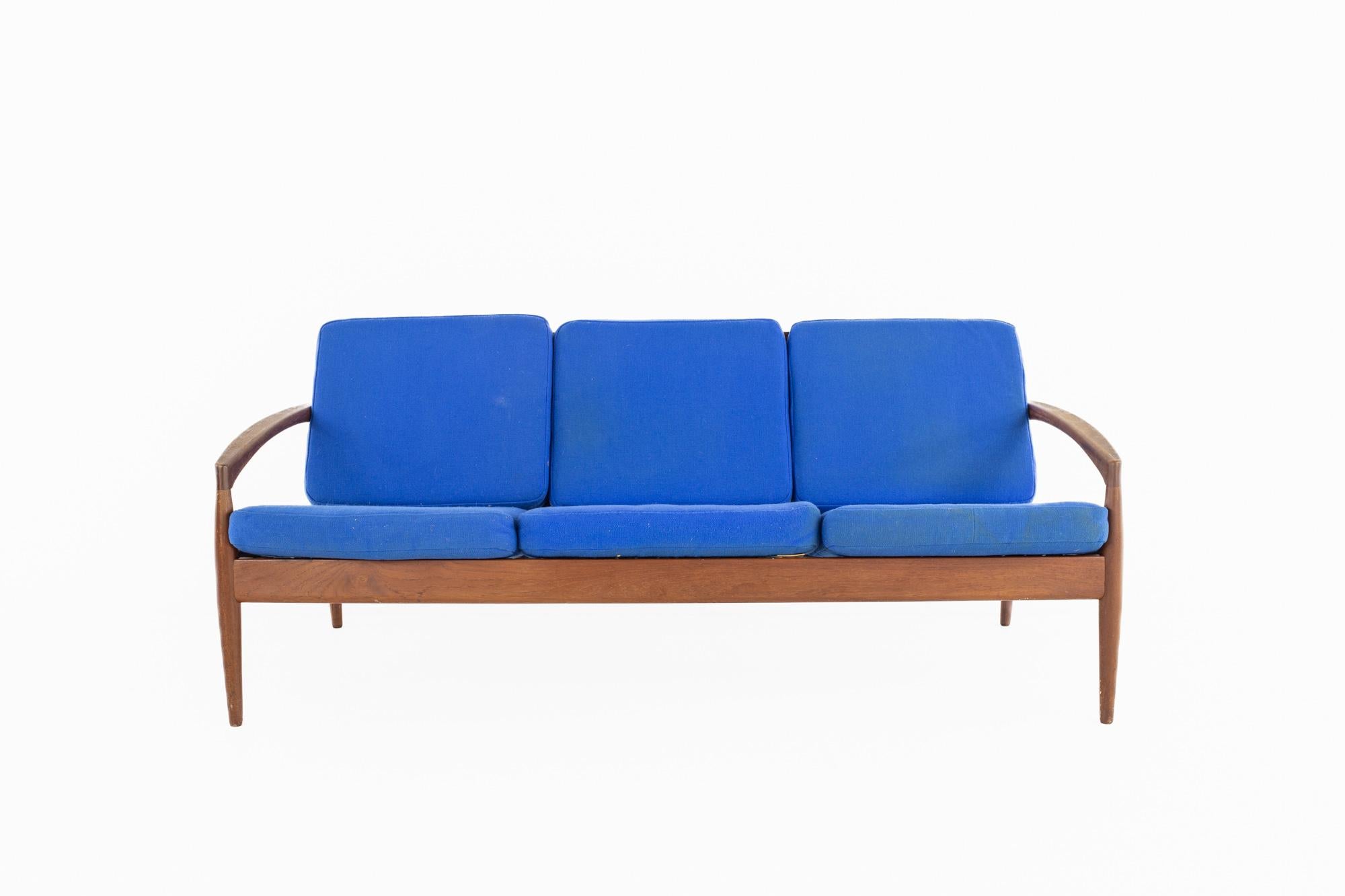 Kai Kristiansen for Magnus Olesen mid century No 121 Paper Knife Teak Sofa

The sofa measures: 63 wide x 21 deep x 27 high, with a seat height of 16 inches

All pieces of furniture can be had in what we call restored vintage condition. That