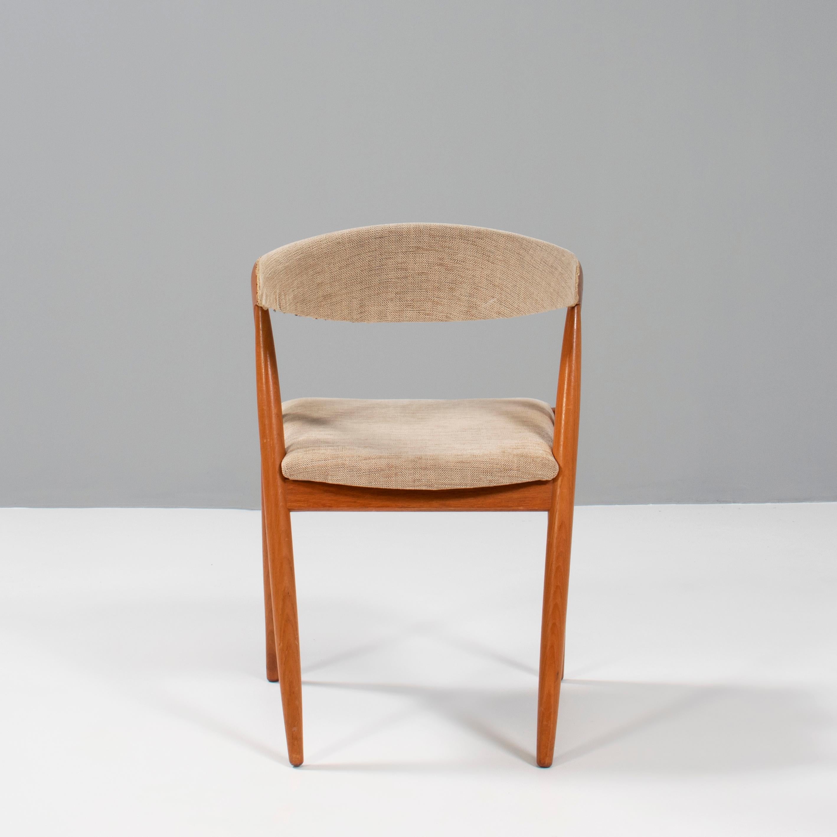 Designed by Kai Kristiansen for Schou Andersen the Model 31 dining chair is a fantastic example of classic Danish Mid-Century design.

Constructed from teak, the chair has a classic silhouette combining a curved backrest with angled legs and arm
