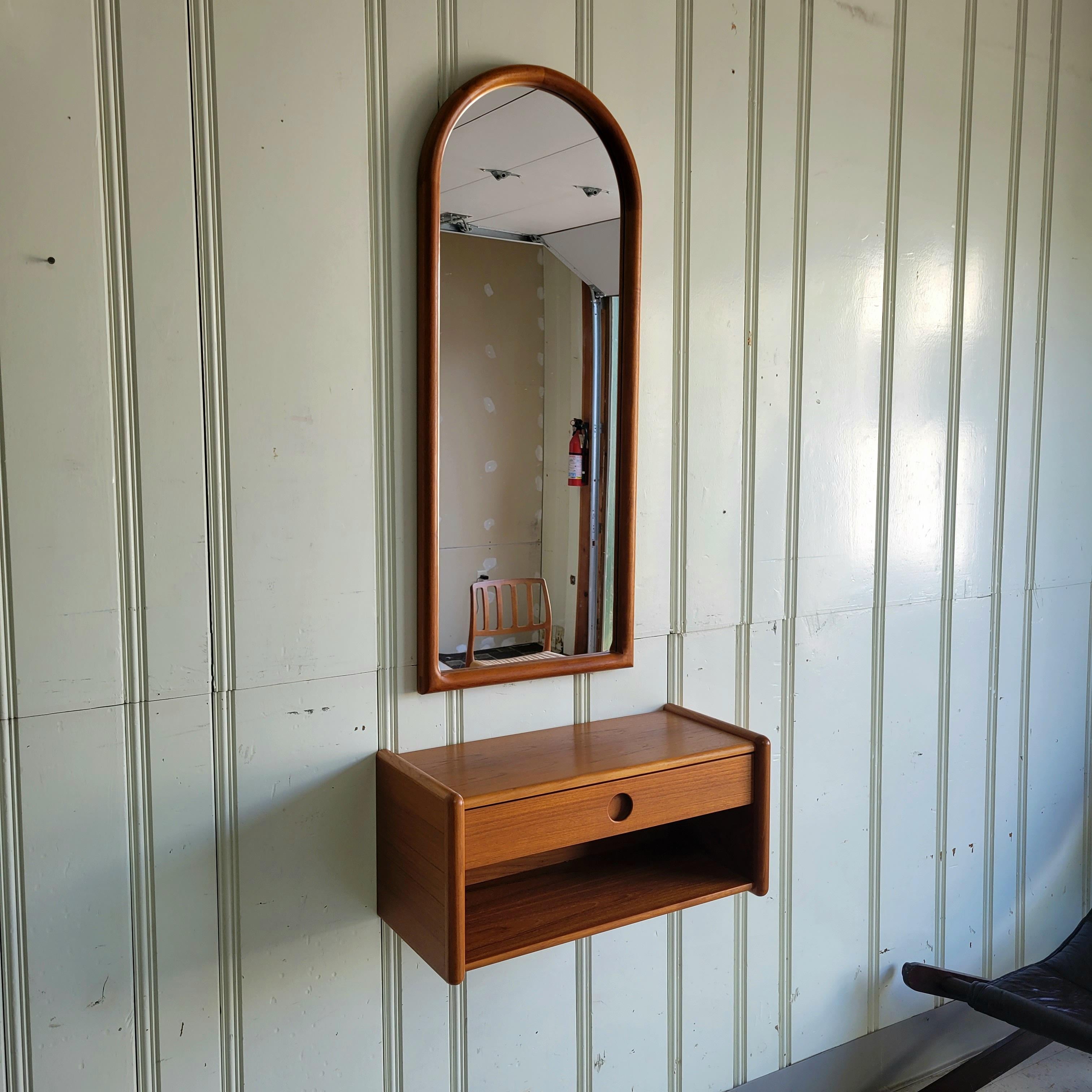 Kai Kristiansen designed teak mirror and floating cabinet for Vildbjerg Møbelfabrik. 

Mirror measures 17.75