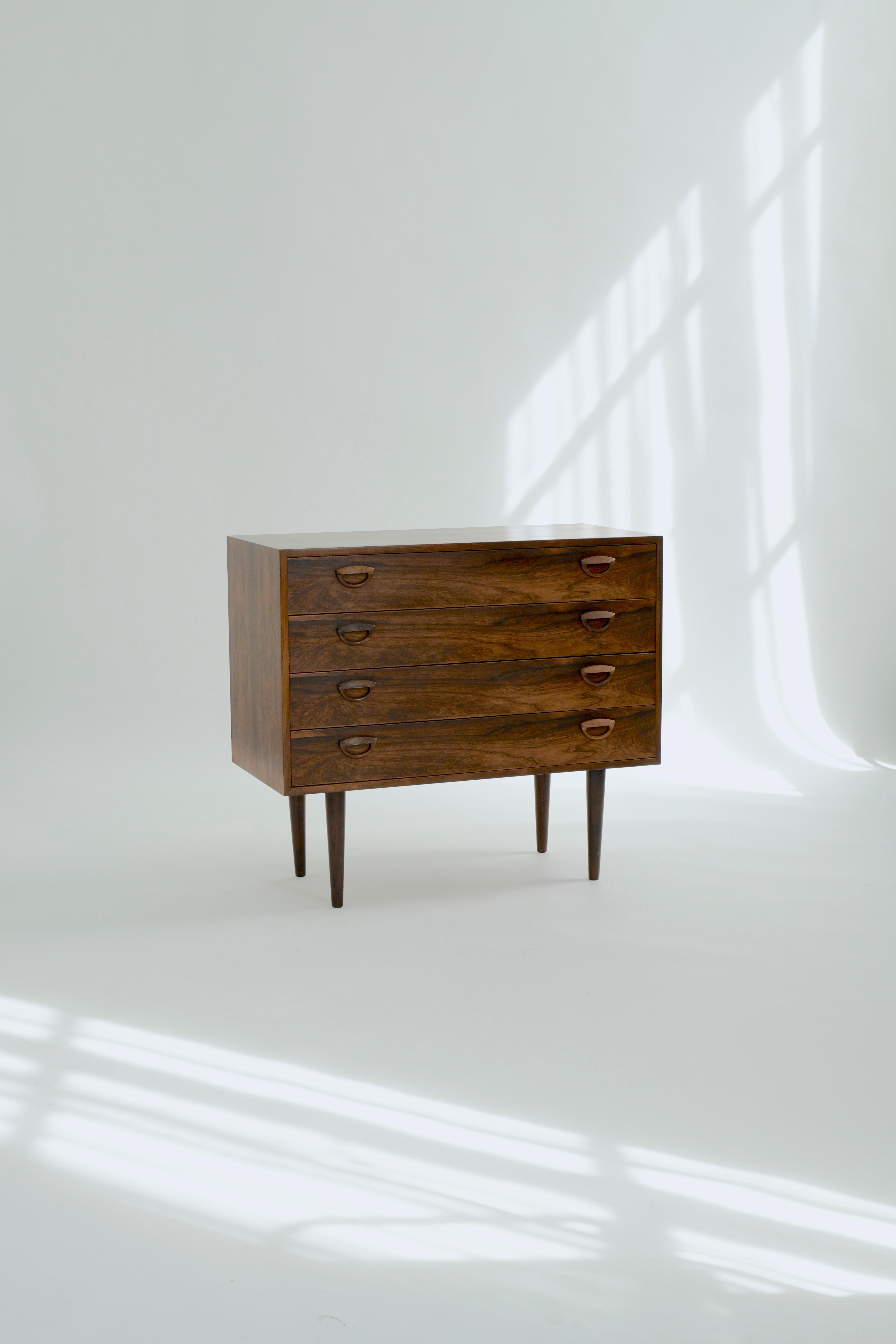 Beautiful 1960s four drawer chest in rosewood by Kai Kristiansen for Fm Møbler, Denmark. 

This chest is in good vintage condition with only some very minor wear to the top in the form of faint rings and small superficial scratches. Overall it