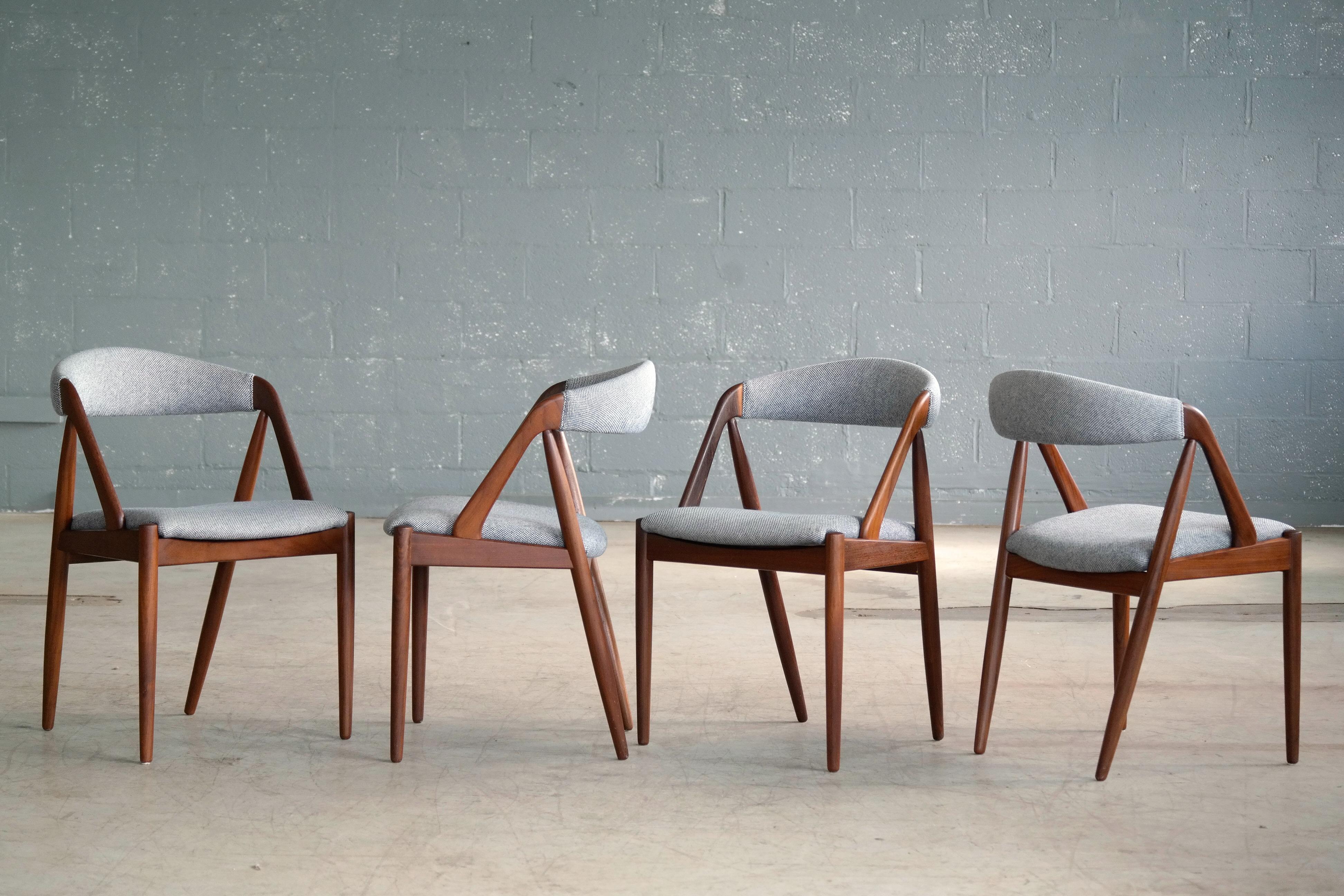 This set of iconic dining room chairs known as Model 31 were designed by Kai Kristiansen in 1956 and manufactured by Schou Andersen in the 1960s in Denmark. The model 31 has become one of the most enduring, iconic and sought after designs to come