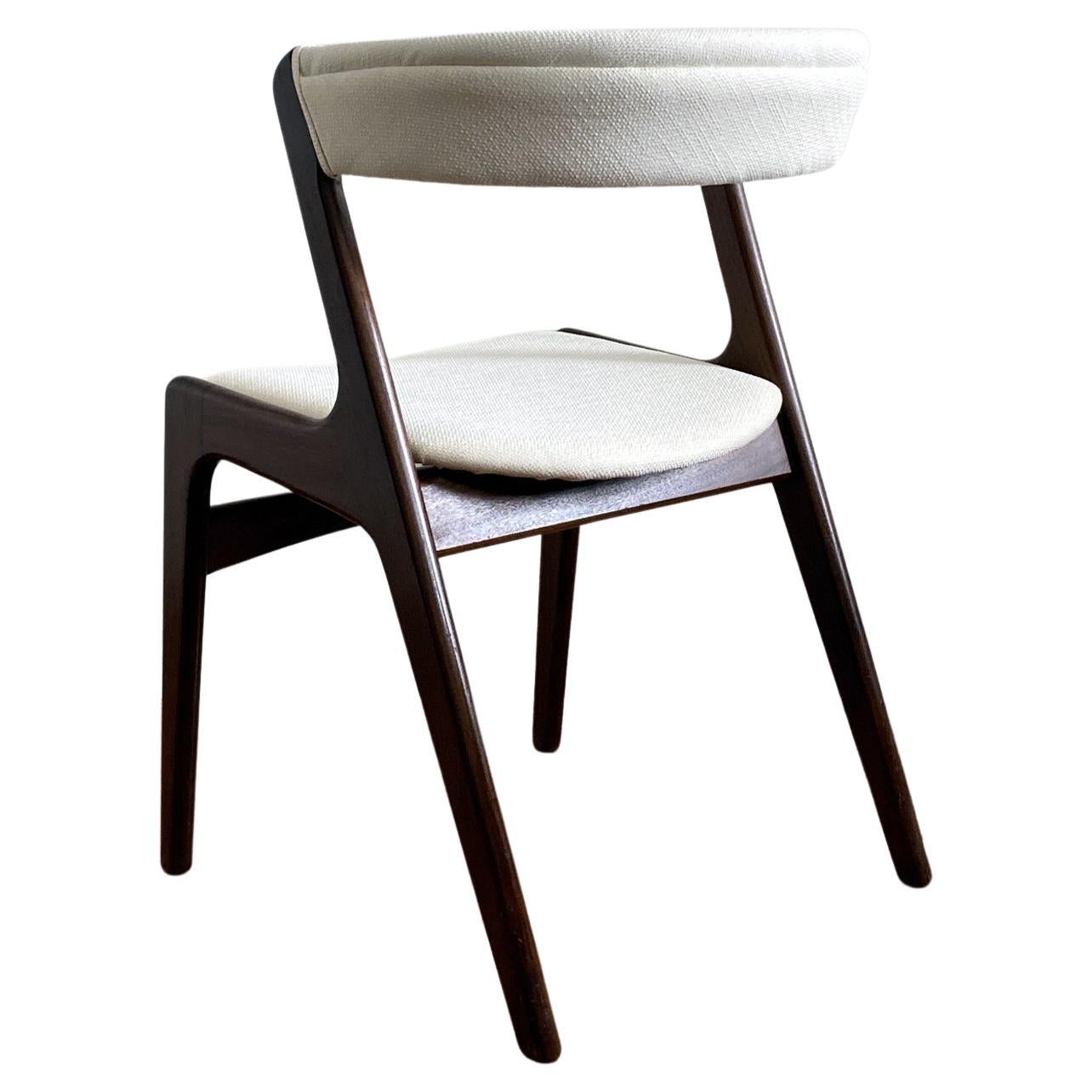 Beautiful midcentury chair, Kai Kristiansen’s iconic curved back chair Silhouette. Teak frame, seat and curved back reupholstered with ivory tweed. Structurally sound, in good vintage condition with very minor scuffs.
