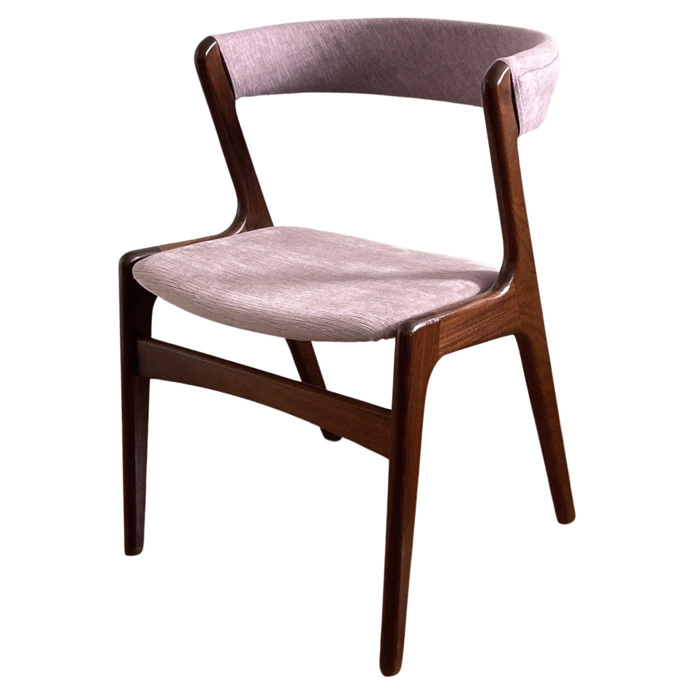 Beautiful midcentury chair, Kai Kristiansen’s iconic curved back chair Silhouette. Teak frame, seat reupholstered with mauve pink velvet and curved back reupholstered in a coordinating mauve tweed. Structurally sound, in good vintage condition with