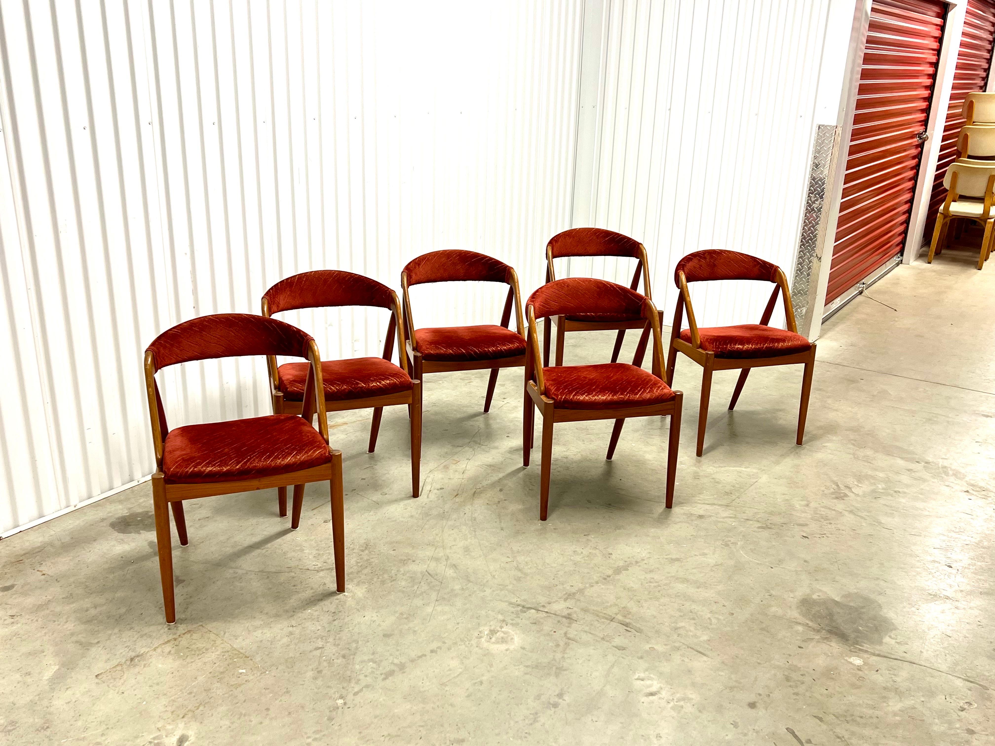 Offered for sale is a rare and stunning set of 6 Danish chairs designed by the renowned designer Kai Kristiansen and crafted by the prestigious manufacturer Schou Andersen.