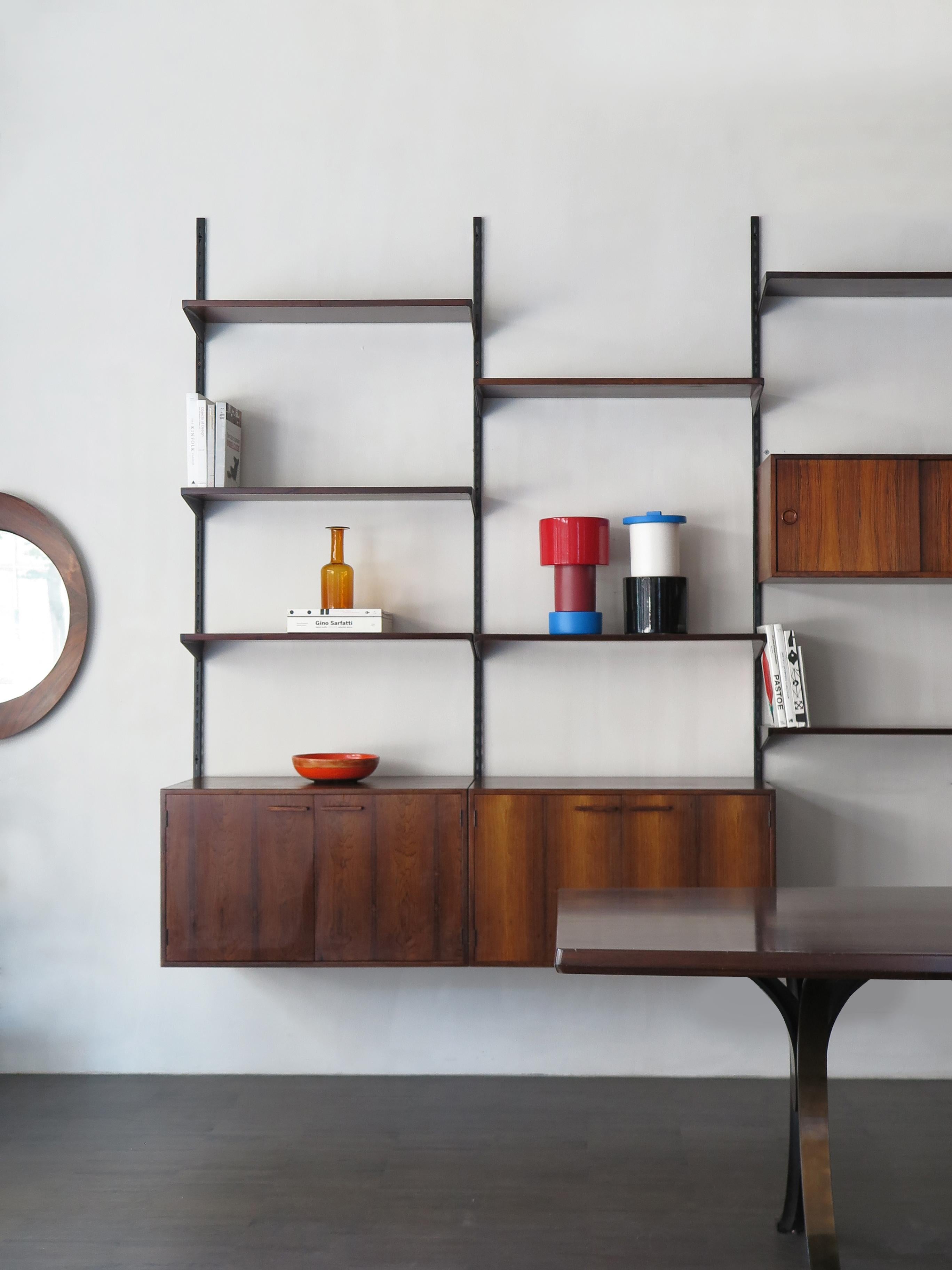 Scandinavian dark wood shelving system designed by Danish designer Kai Kristiansen for FM Mobler, wood box and shelves can be positioned as desired; manufacture label., circa 1960.

Please note that the item is original of the period and this