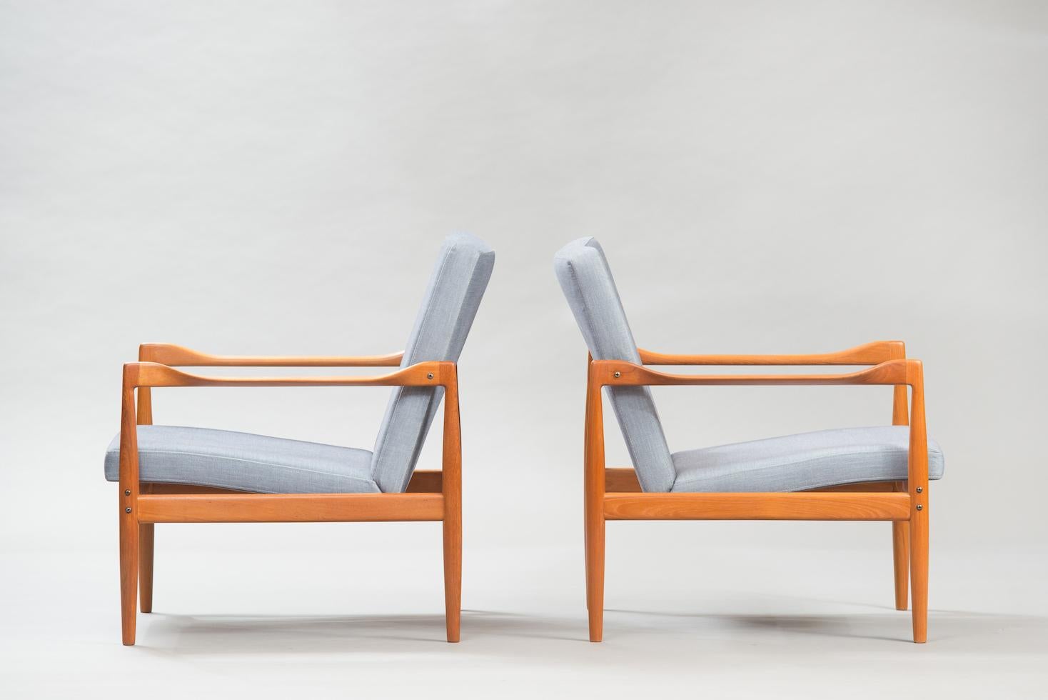 Pair of midcentury teak lounge chairs reupholstered in velvet.